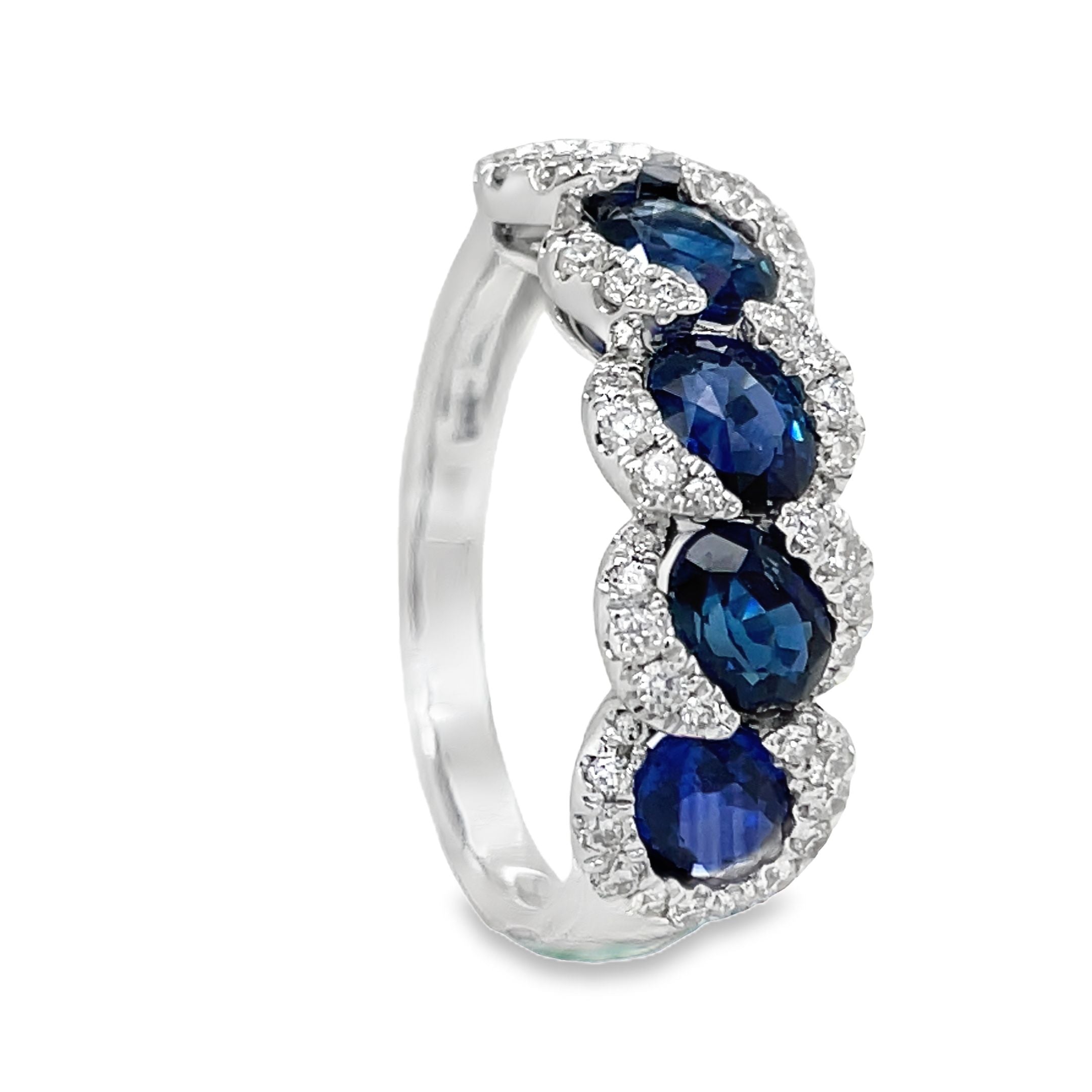 his 18k white gold ring features five stunning oval sapphires, totaling 2.32 carats, and sparkling round diamonds with a total weight of 0.43 carats. The perfect combination of elegance and femininity, this ring is sure to make a statement.