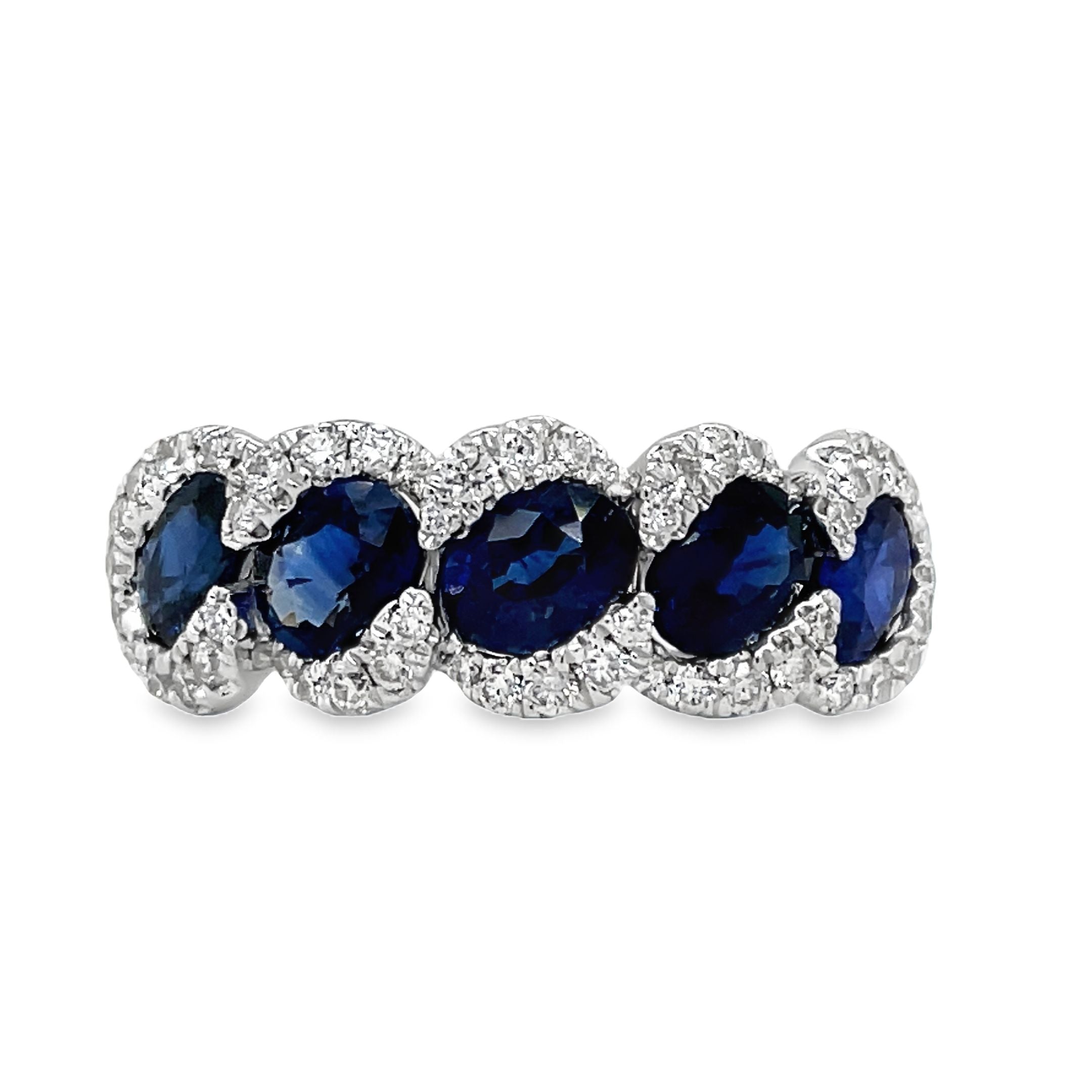 his 18k white gold ring features five stunning oval sapphires, totaling 2.32 carats, and sparkling round diamonds with a total weight of 0.43 carats. The perfect combination of elegance and femininity, this ring is sure to make a statement.