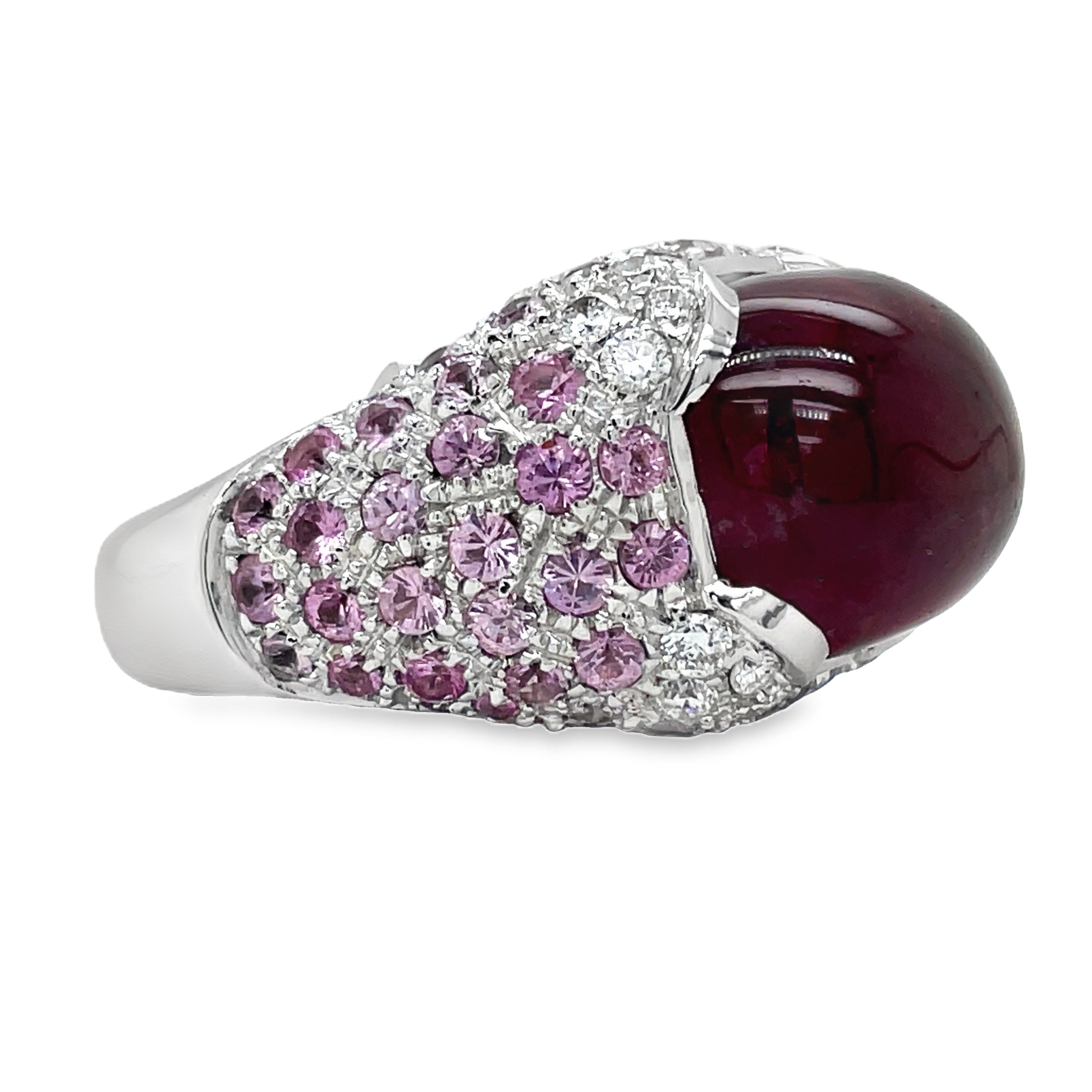 Elevate your style with this luxurious Italian-made ring. Crafted with 18k white gold, it features a stunning ruby cabochon (4.88 cts) and a vibrant pink topaz (7.60 cts). Adorned with round diamonds (0.64 cts) in a pave setting, this ring exudes elegance and sophistication.