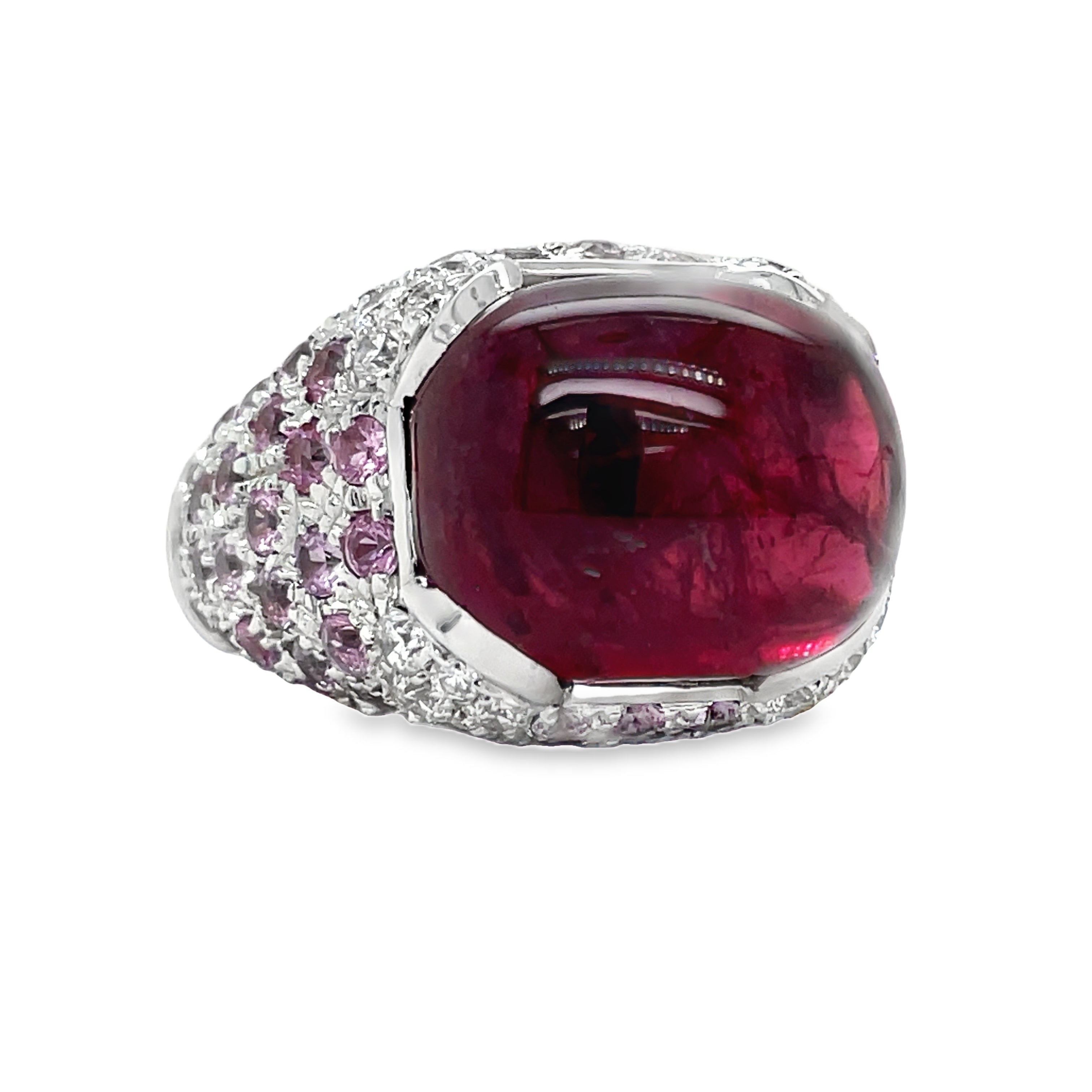 Elevate your style with this luxurious Italian-made ring. Crafted with 18k white gold, it features a stunning ruby cabochon (4.88 cts) and a vibrant pink topaz (7.60 cts). Adorned with round diamonds (0.64 cts) in a pave setting, this ring exudes elegance and sophistication.