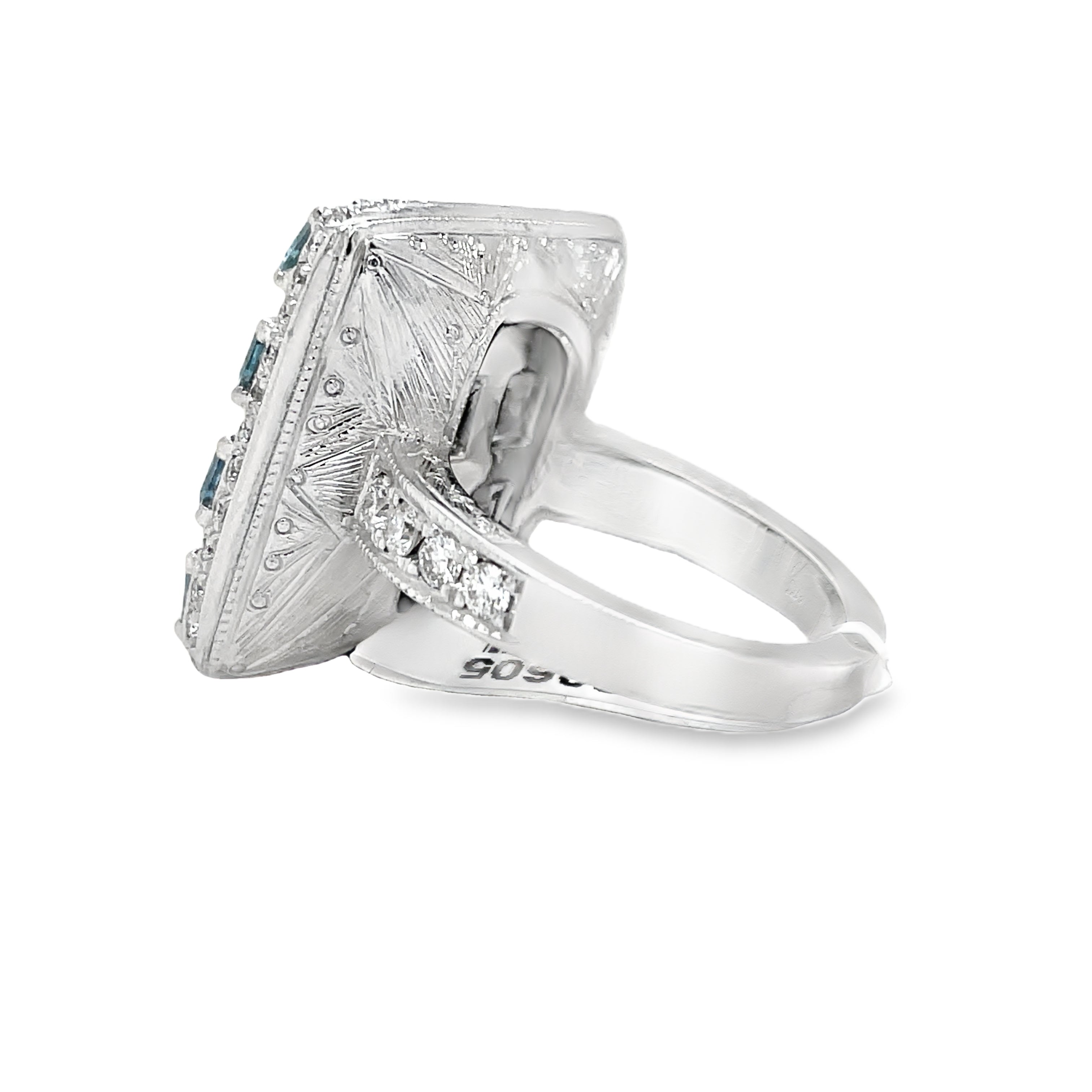 Introducing our Italian-made Aquamarine and Diamond Fashion Ring. Hand-engraved with a square design, this ring radiates luxury and sophistication. Crafted with 18k white gold, a 2.20 carat cushion-cut aquamarine and 1.49 carats of sparkling round diamonds, this piece is a masterpiece of elegance. Elevate your style with this exclusive and timeless ring.