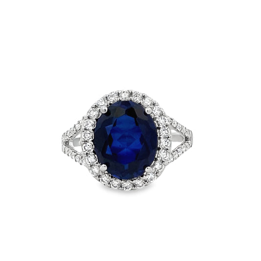 Front view of Oval Shape Blue Faceted Sapphire and Diamond Ring
