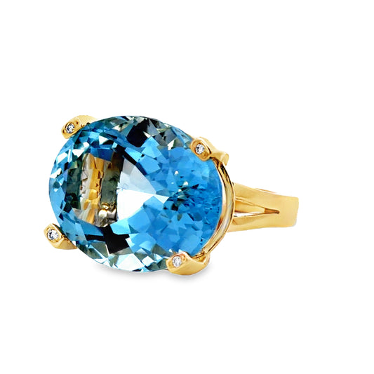 Side view of Oval Aquamarine Solitaire & Diamond Ring in Yellow Gold