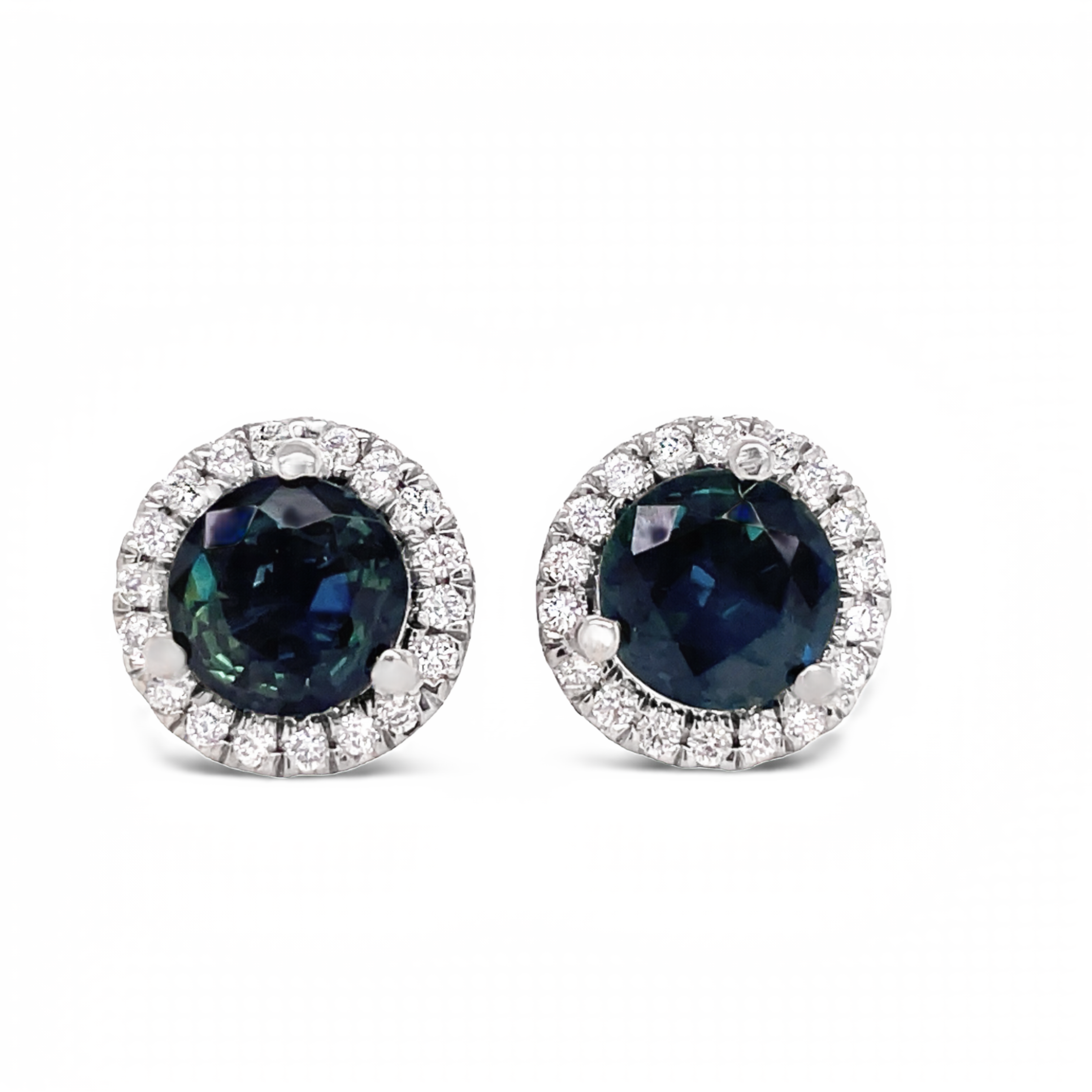 These beautiful medium blue sapphire and diamond stud earrings are crafted in 18k white gold. They feature 2.00 cts round faceted sapphires and 0.50 cts round diamonds for a unique, and elegant look.
