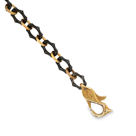 A striking accessory for the modern man, this Mens 18K Rose Gold & Oxidated Sterling Silver Dragon Clasp Bracelet is an iconic piece with a unique style. Crafted from 18k rose gold and sterling silver, its dragon-style clasp creates a secure and eye-catching closure to complete your look.