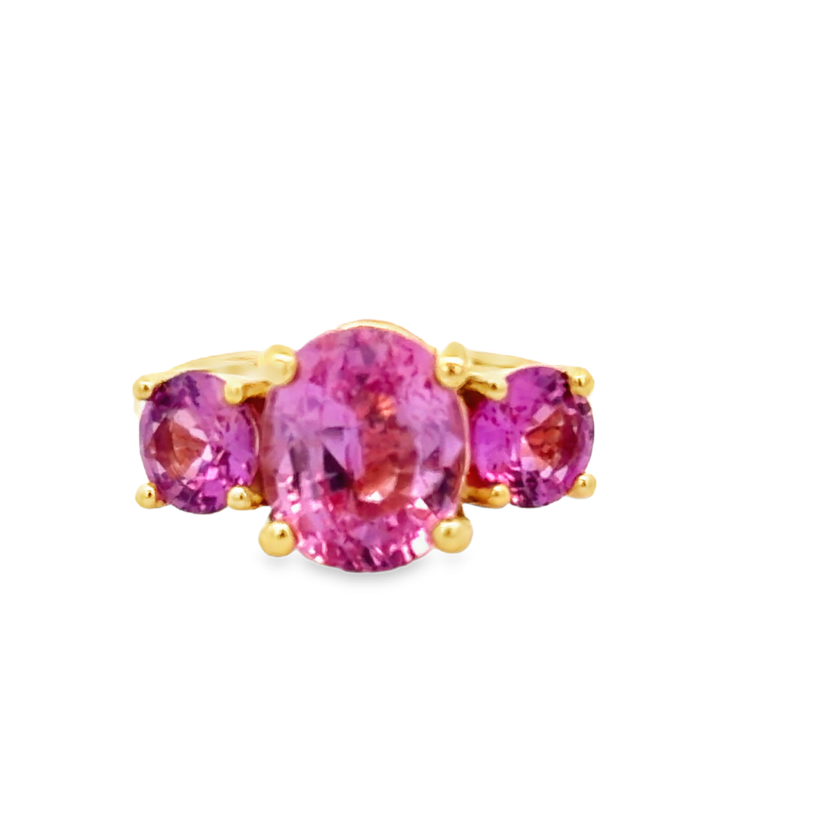Front view of 18K Vivid Pink Sapphire Three-Stone Ring in Yellow Gold