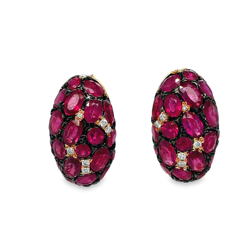 Indulge in luxury with our Ruby & Diamond Large Earrings! The oval shape rubies, 1.40 cts, are set in 18k rose gold and accented with black rhodium. Each earring also features 0.20 cts of sparkling round diamonds and a secure omega clip system. Elevate your style with these stunning and sophisticated earrings!