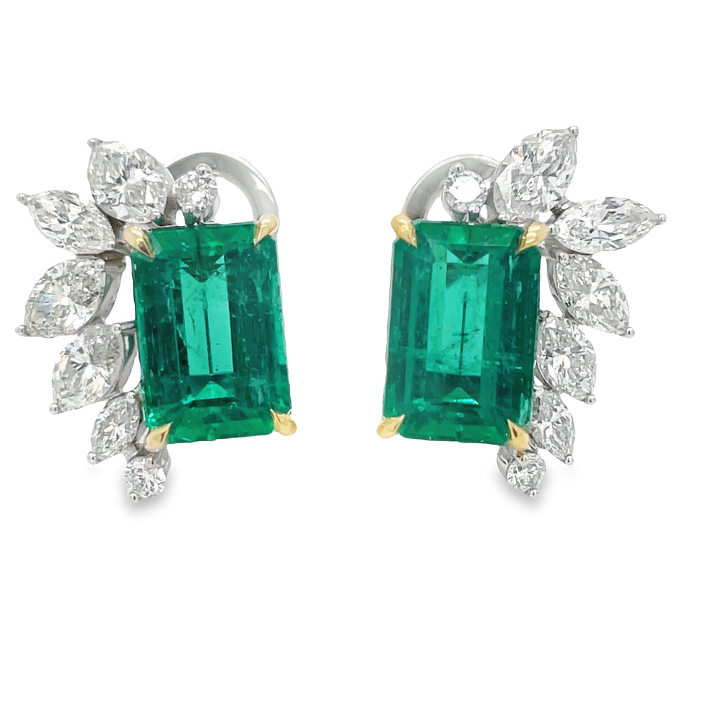 These Afghan Emerald and Marquise Diamond Stud Earrings feature a 5.90 cts emerald cut emerald in 18k yellow and white gold, complimented by 14 graduated marquise diamonds. This elegant earring set is perfect for those looking to add the perfect combination of sparkle and sophistication to their look.