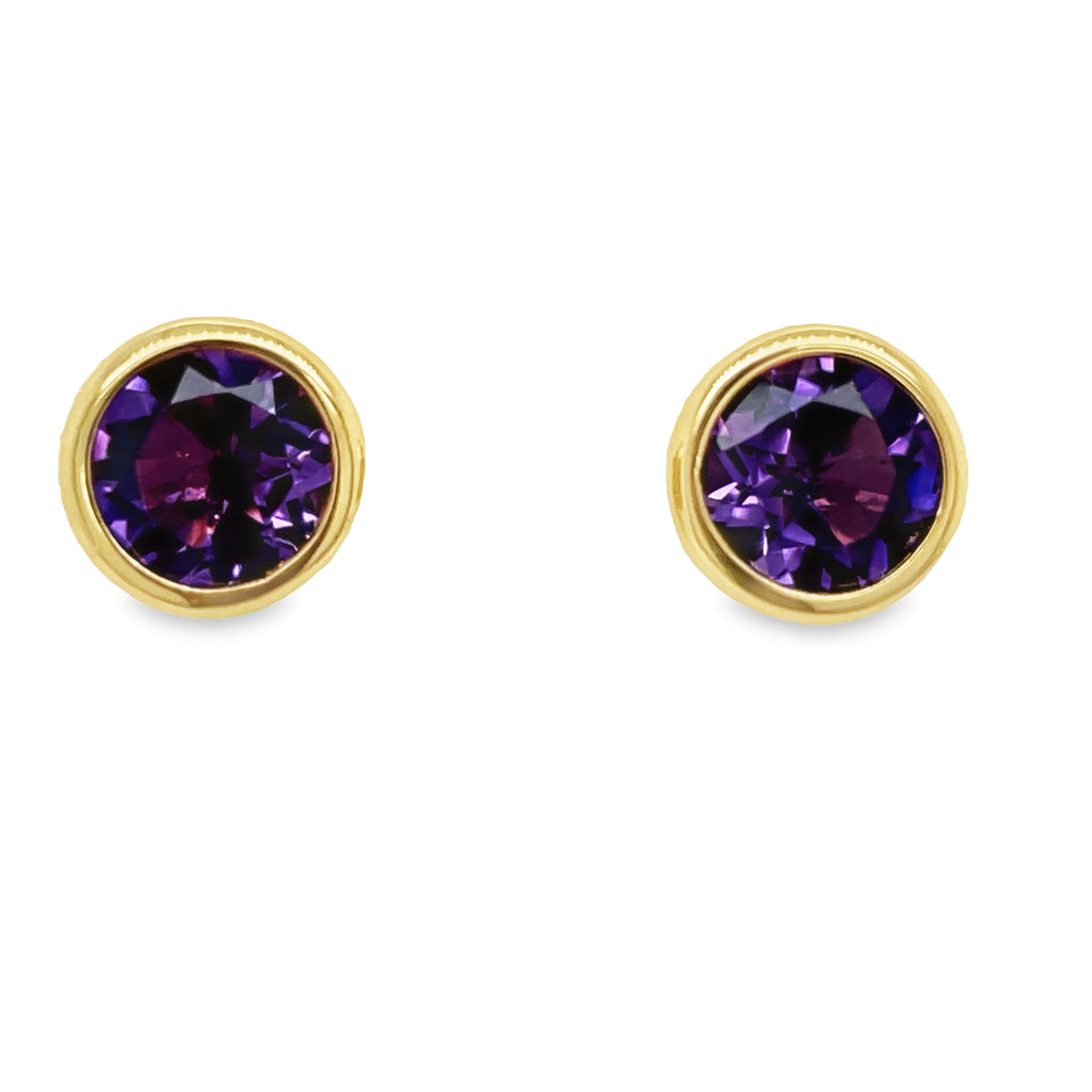 Beautifully crafted in 18k yellow gold, these citrine stud earrings will add a luxurious sparkle to any outfit. The large round amethyst are secured with friction backs, ensuring a secure fit that will make you feel confident. Make a bold and sophisticated statement with these stunning earrings!