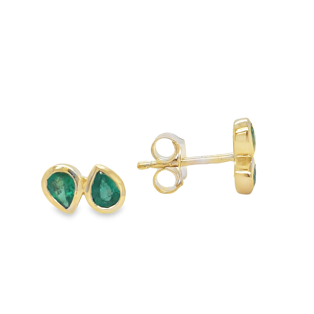 Add a touch of elegance to any outfit with our Dainty Double Emerald Stud Earrings. The double-shaped emeralds, set in 14k yellow gold, make a classic and sophisticated statement. The secure friction backs ensure your earrings stay in place all day. Make a statement with these stunning and versatile earrings!