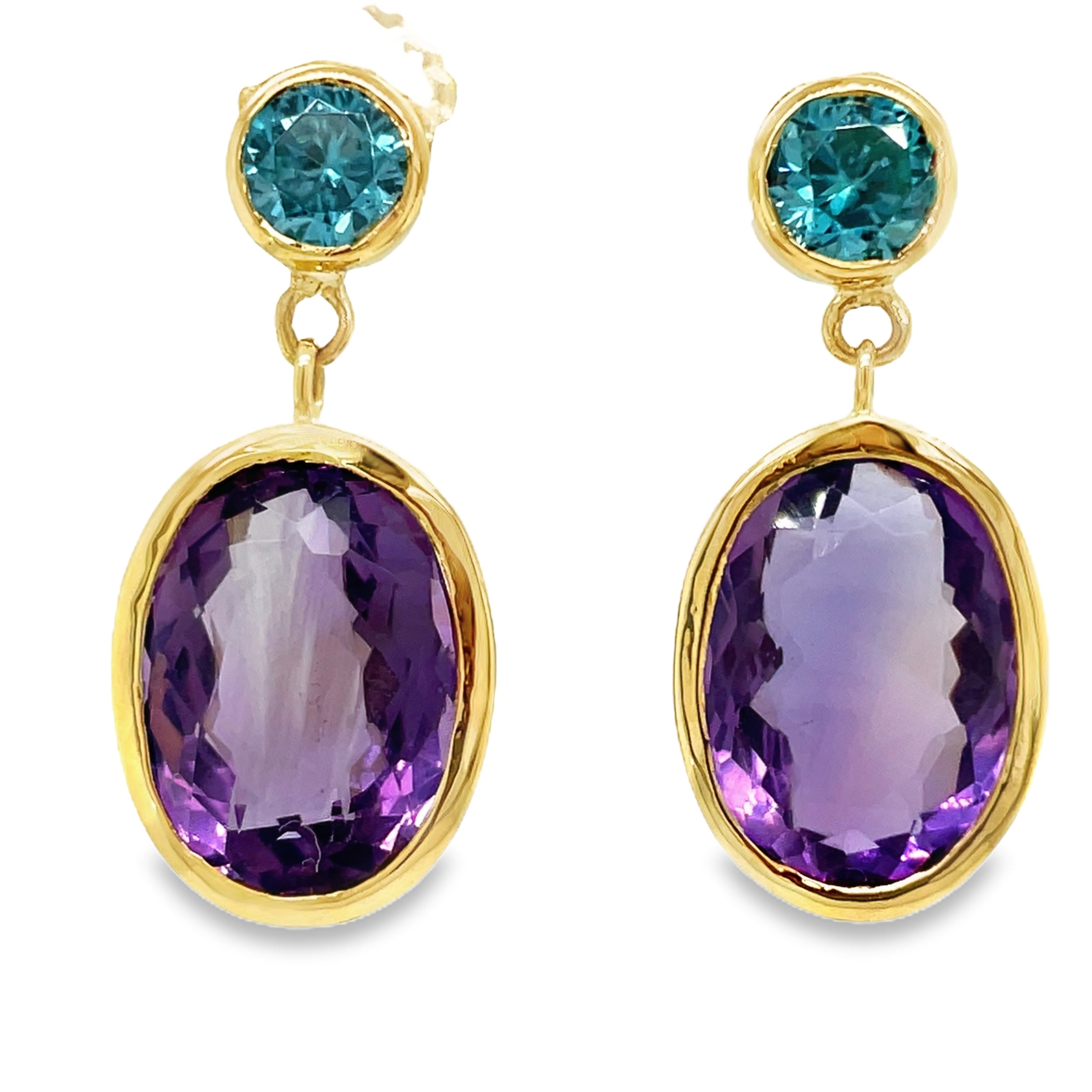 These 14k yellow gold earrings feature exquisite bezel set amethyst and blue zircon stones, adding a touch of sophistication to any outfit. The secure friction backs ensure they stay in place all day. Elevate any ensemble with these elegant, 1" long earrings.