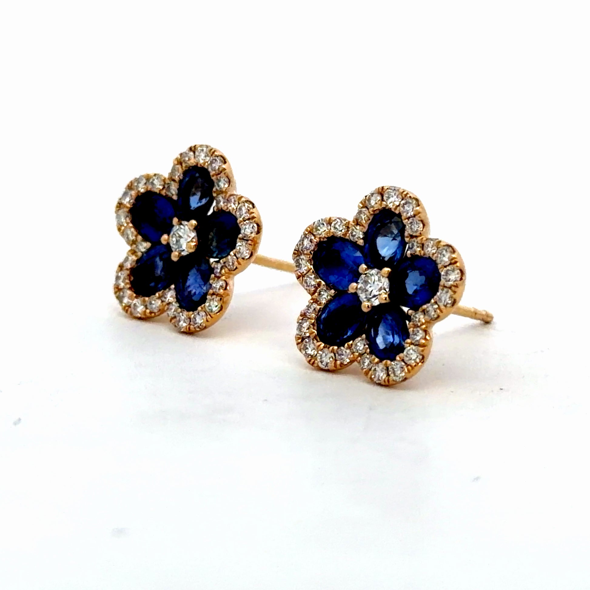Side view of 18k Yellow Gold Royal Blue Sapphire Floral Halo Stud Earrings