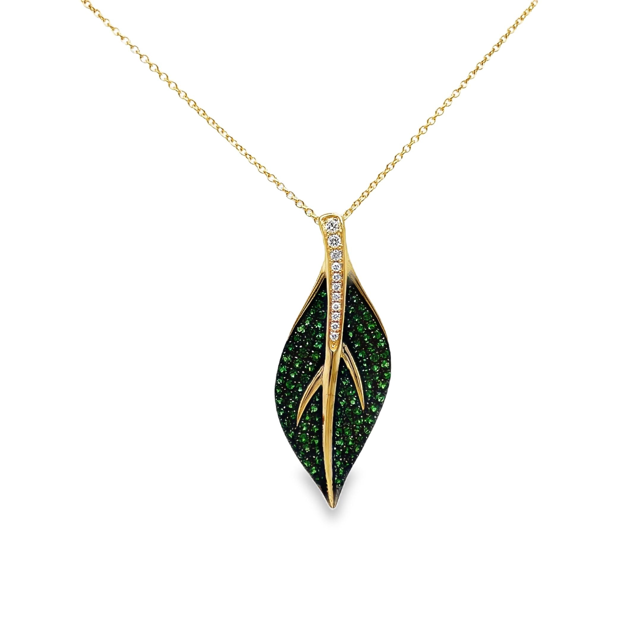 Indulge in luxury with our exquisite Tsavorite and Diamond Leaf Pendant Necklace. Crafted in 14k yellow gold, this necklace features brilliant tsavorite gems and round diamonds in a stunning leaf shape pendant. Elevate any outfit with this elegant and exclusive piece.

18" yellow gold chain optional $399.00