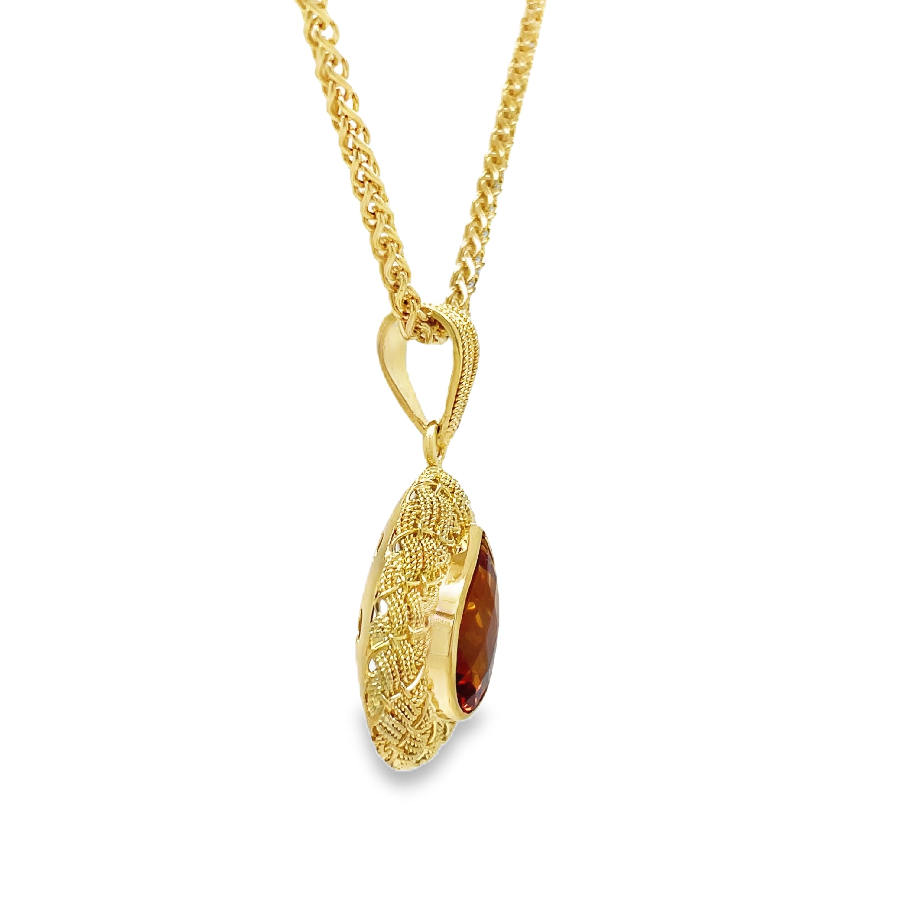 levate your style with our Italian Made Trillion Citrine Pendant Necklace. Crafted with 18k yellow gold in a stunning matte finish, this necklace showcases a woven style and a mesmerizing pear shape Madeira citrine. Handcrafted in Italy with attention to detail, it exudes luxury and sophistication.

30.00 mm size&nbsp;

Chain not included ($700)