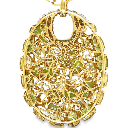 This exquisite Italian-made pendant necklace features multishade peridot gems and brilliant round diamonds 1.00 cts set in 18k yellow gold. Enjoy the unique sparkle of this luxurious necklace, sure to turn heads wherever you go.
