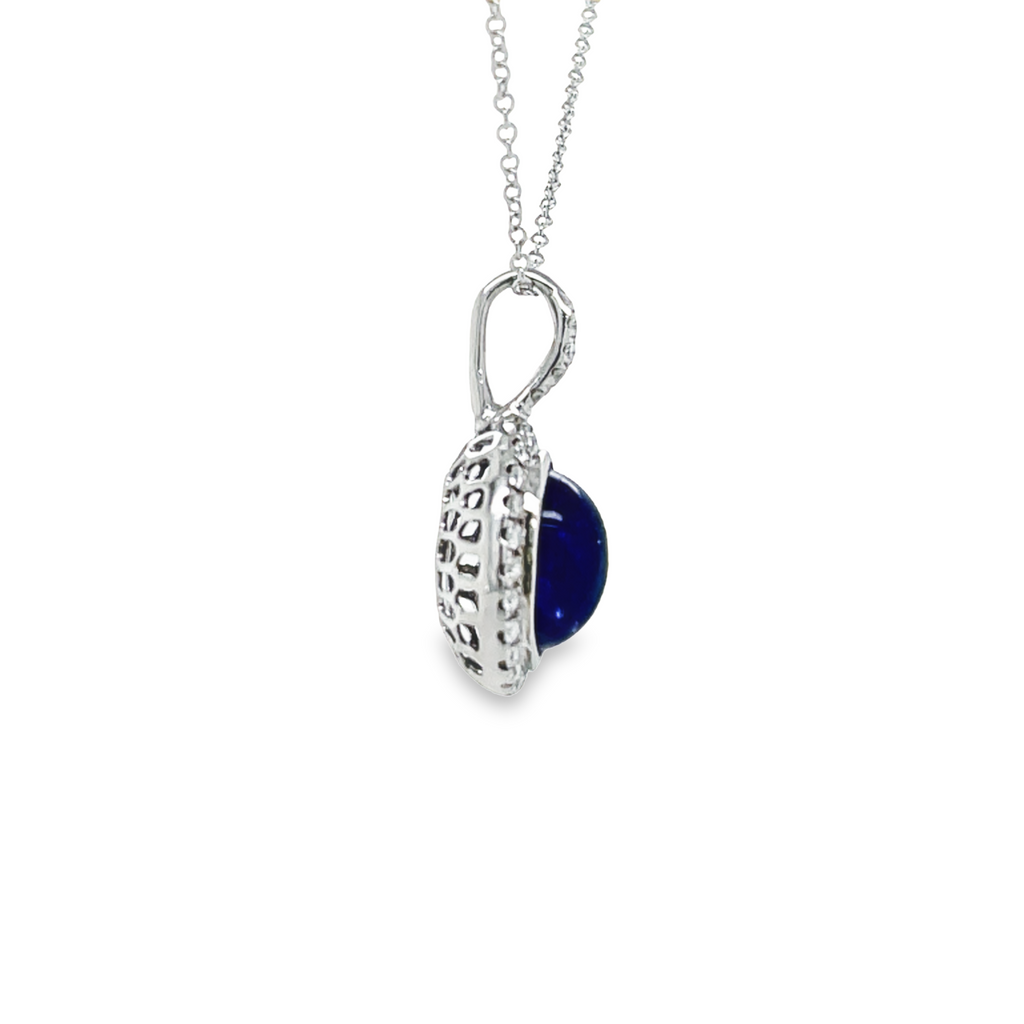 This delicate pendant necklace is crafted with an 18kt white gold gallery finish and features a cabochon tanzanite that is delicately accented with diamonds. Enhance your neckline with this sophisticated style. 16 Inch White Gold Chain optional ($210)