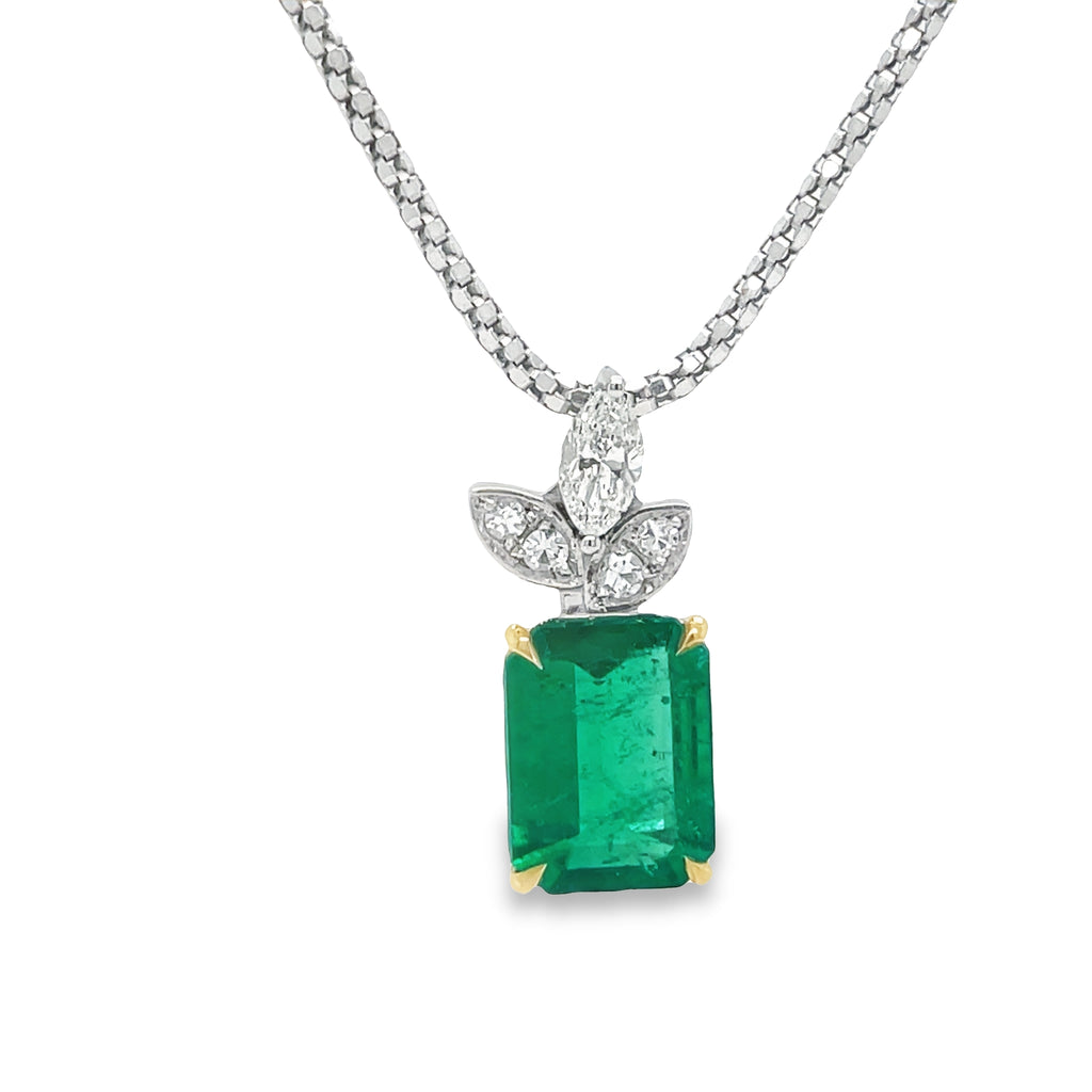 This exquisite Afghan Emerald & Marquise Diamond Pendant Necklace is crafted with an impressive 3.39 cts emerald cut emerald surrounded by three marquise diamond accents. Set in 18k two-tone Italian white gold, the necklace comes with an optional ($550) matching chain for a stunning overall look.