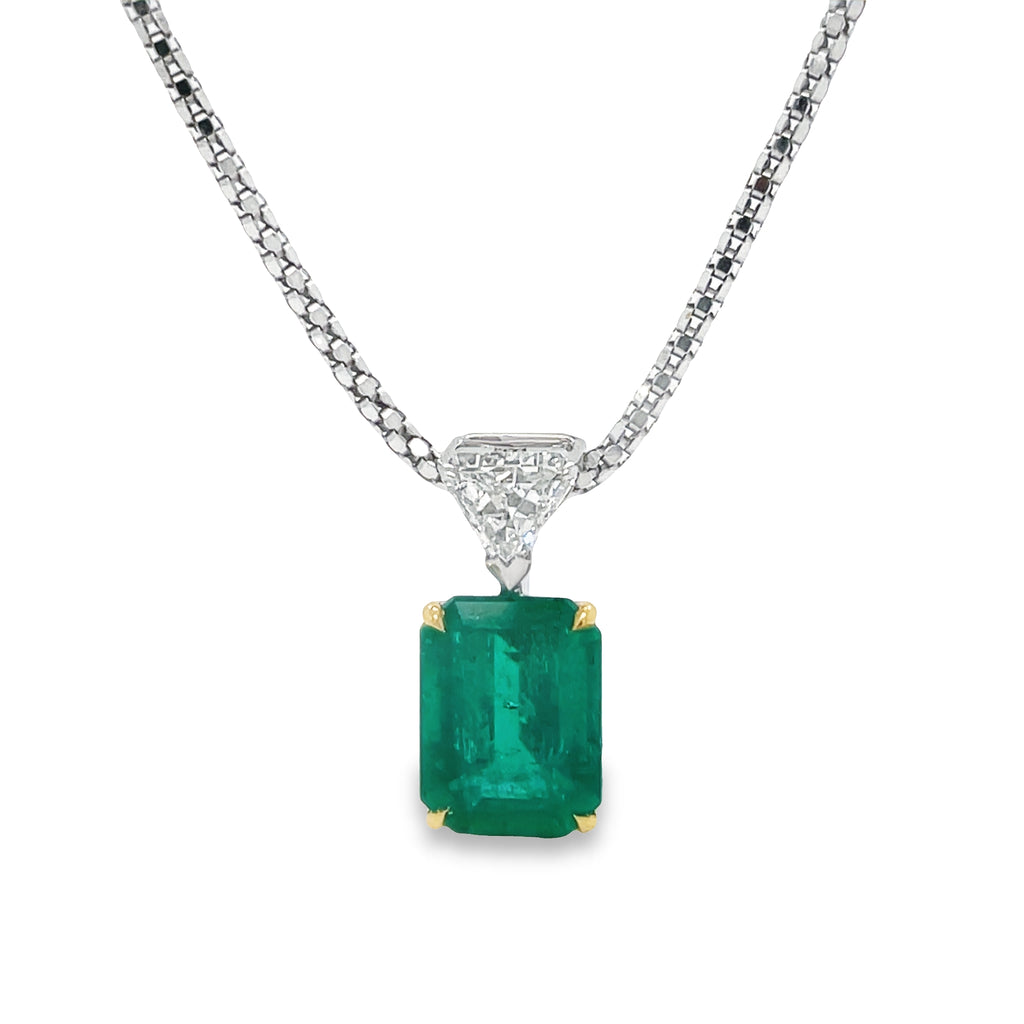 This exquisite Afghan Emerald & Marquise Diamond Pendant Necklace is crafted with an impressive 2.80 cts emerald cut emerald surrounded by a trillian diamond accent. Set in 18k two-tone Italian white gold, the necklace comes with an optional ($550) matching chain for a stunning overall look.
