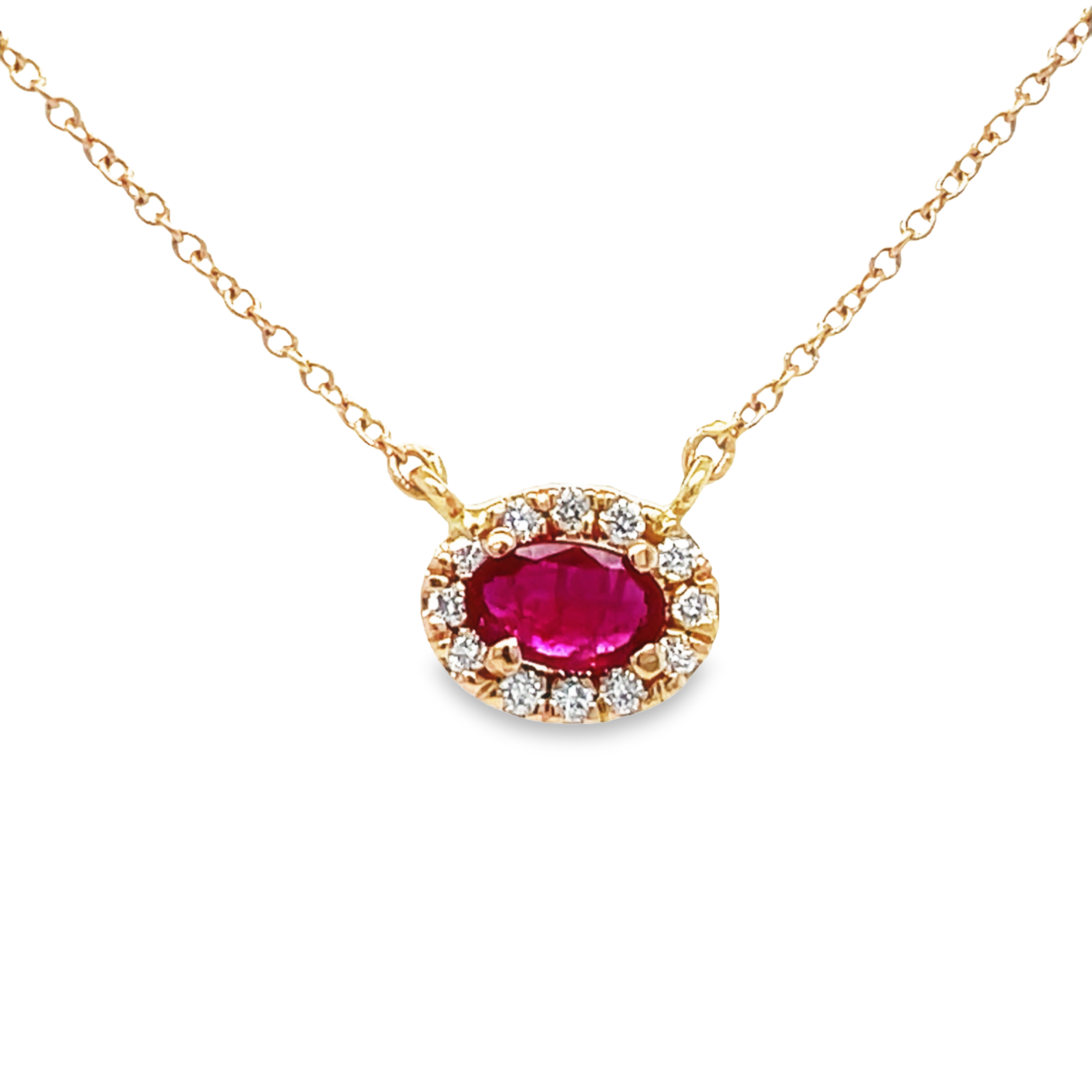 This exquisite Diamond Bezel Horizontal Oval Ruby Necklace features a stunning 0.55 ct oval ruby enhanced by a 0.20 ct diamond bezel, all set in beautiful rose gold. The 16" length of the necklace ensures a truly eye-catching look, perfect for any special occasion