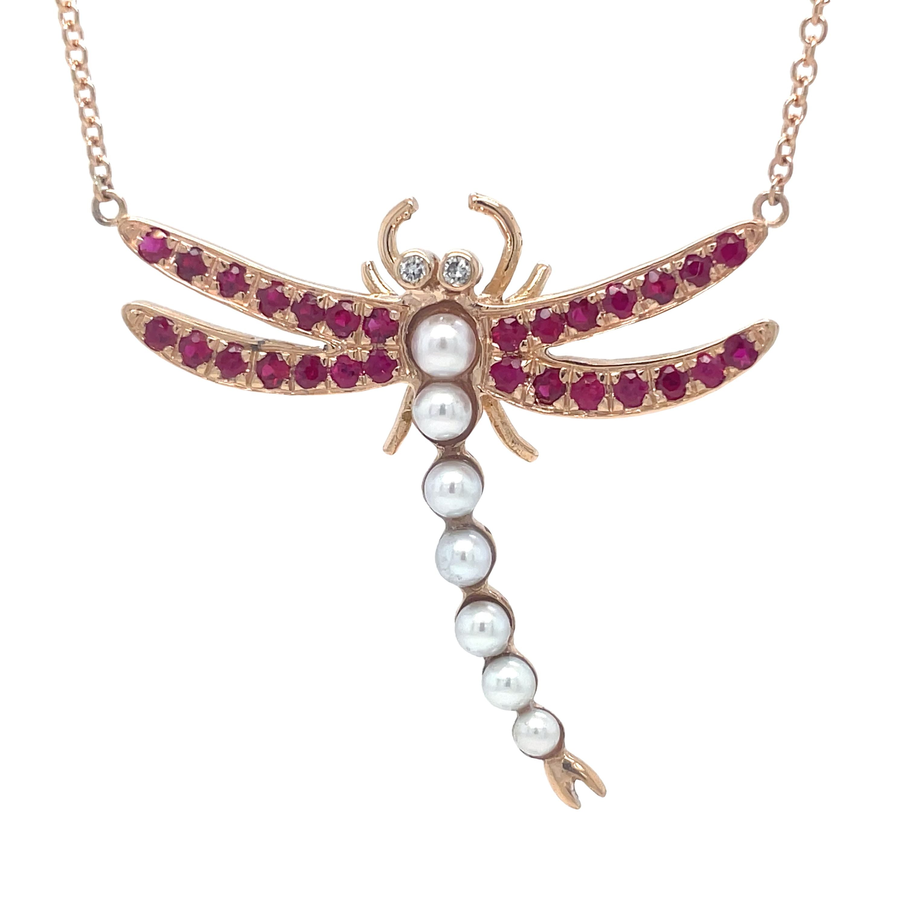 This one-of-a-kind custom made dragonfly pendant necklace is crafted with custom 18k rose gold and adorned with a stunning dragonfly pendant and 7 cultured pearls. The round rubies add a touch of elegance to this 18-inch rose gold necklace. Elevate any outfit with this unique and luxurious piece!