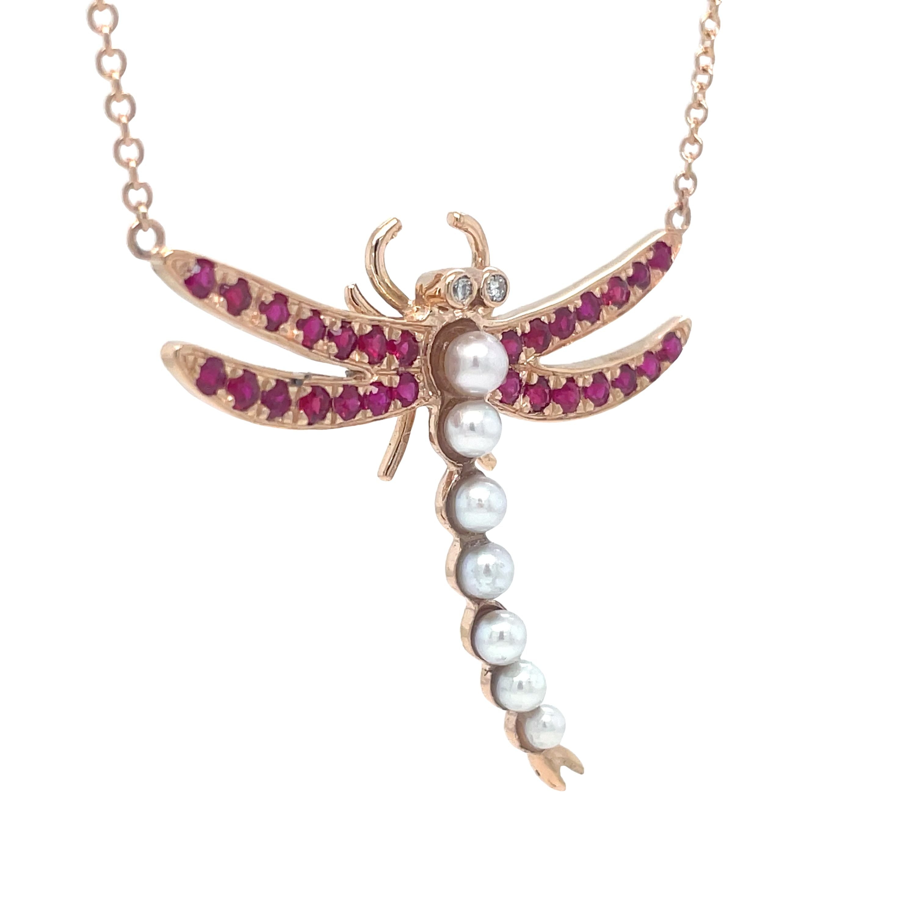 This one-of-a-kind custom made dragonfly pendant necklace is crafted with custom 18k rose gold and adorned with a stunning dragonfly pendant and 7 cultured pearls. The round rubies add a touch of elegance to this 18-inch rose gold necklace. Elevate any outfit with this unique and luxurious piece!
