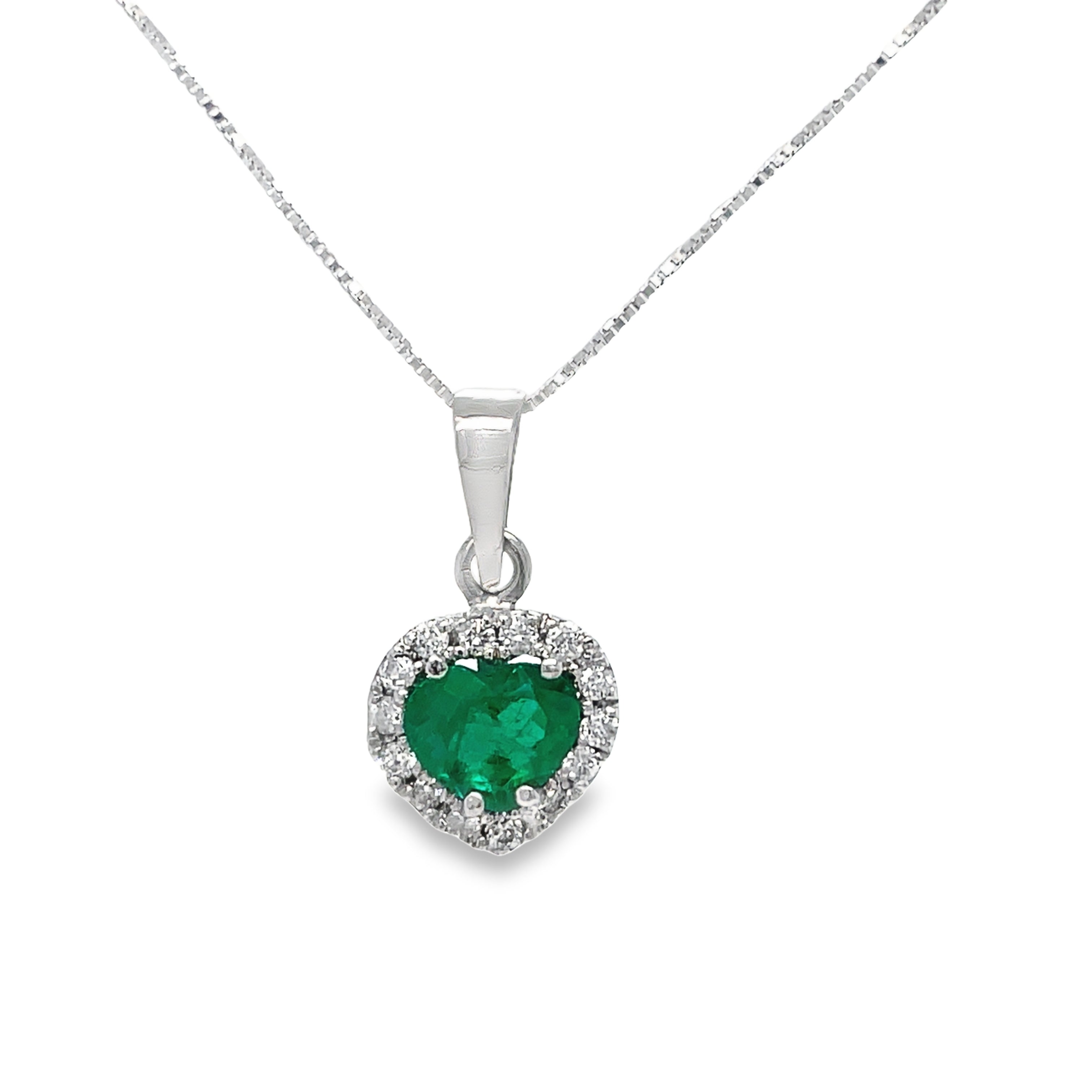 Elevate your love with our Small Solitaire Heart Shape Emerald &amp; Diamond Pendant Necklace. The vibrant heart-shaped Colombian emerald, set in 18K yellow gold, symbolizes passion and devotion. Adorned with a cluster of sparkling round diamonds (0.22 cts), this necklace is a perfect gift for your Valentine. 18" long.