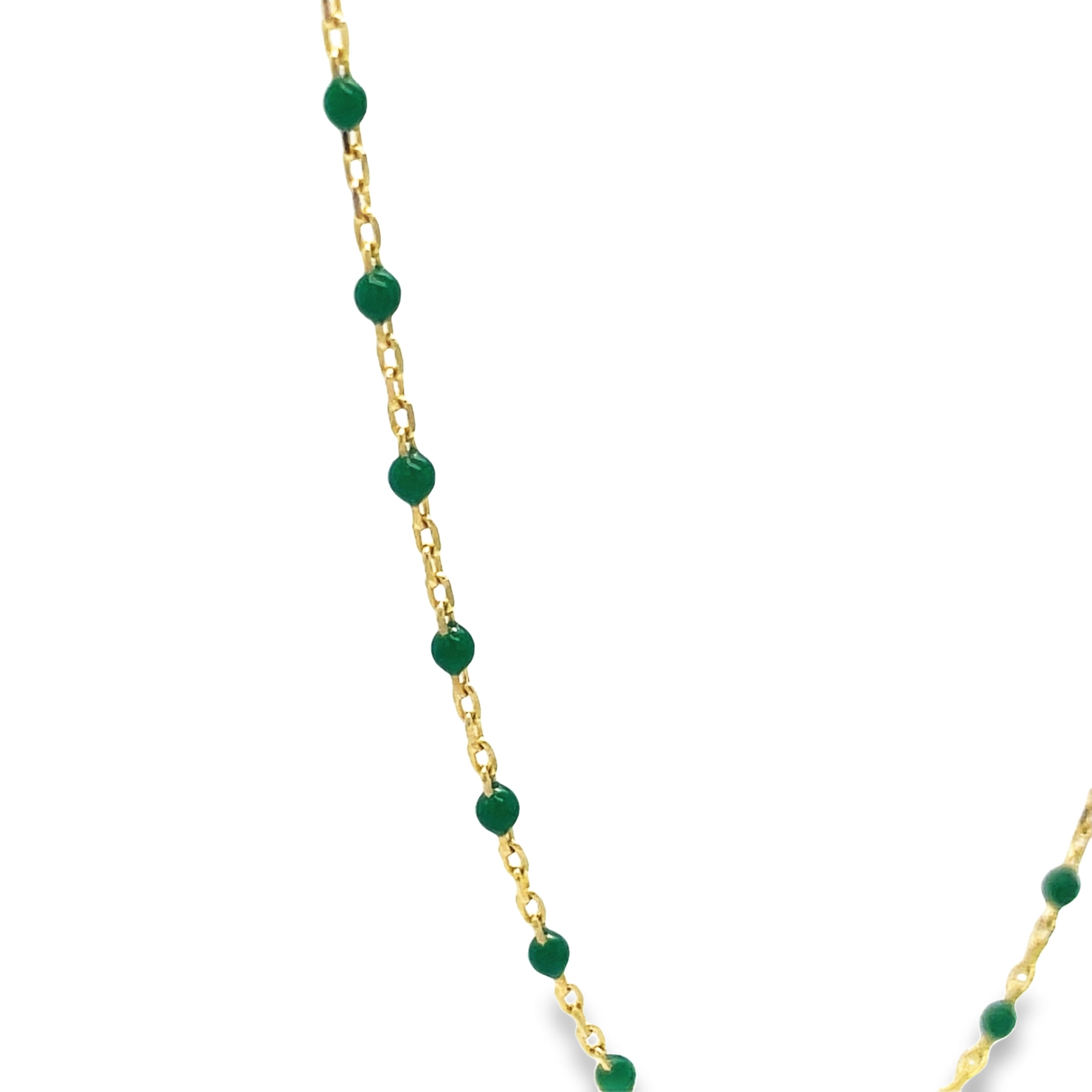 Expertly crafted with 14k yellow gold, this necklace boasts a sleek 18" length and features delicate, small enamel beads in a sophisticated green hue. The addition of a convenient sizing loop ensures perfect and comfortable fit. Enhance any outfit with this elegant and timeless piece of jewelry.