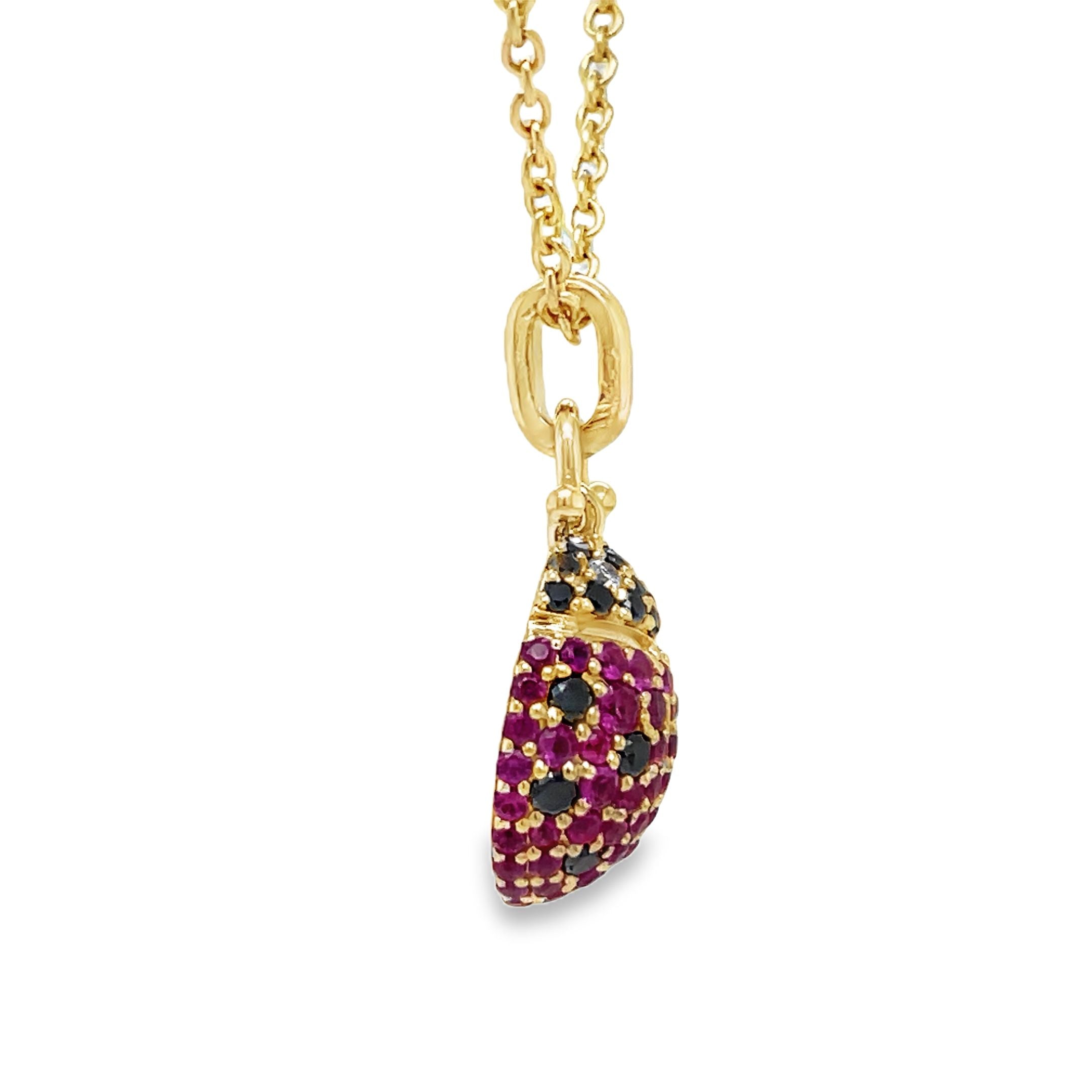 Indulge in luxury with our 14k Diamond Lady Bug Necklace. Crafted with 14k yellow gold, this exquisite piece features a 18.00 mm stunning lady bug design adorned with round black and pink sapphires totaling 0.49 carats. With an adjustable 18" chain and secure lobster clasp, this necklace adds a touch of sophistication to any outfit.