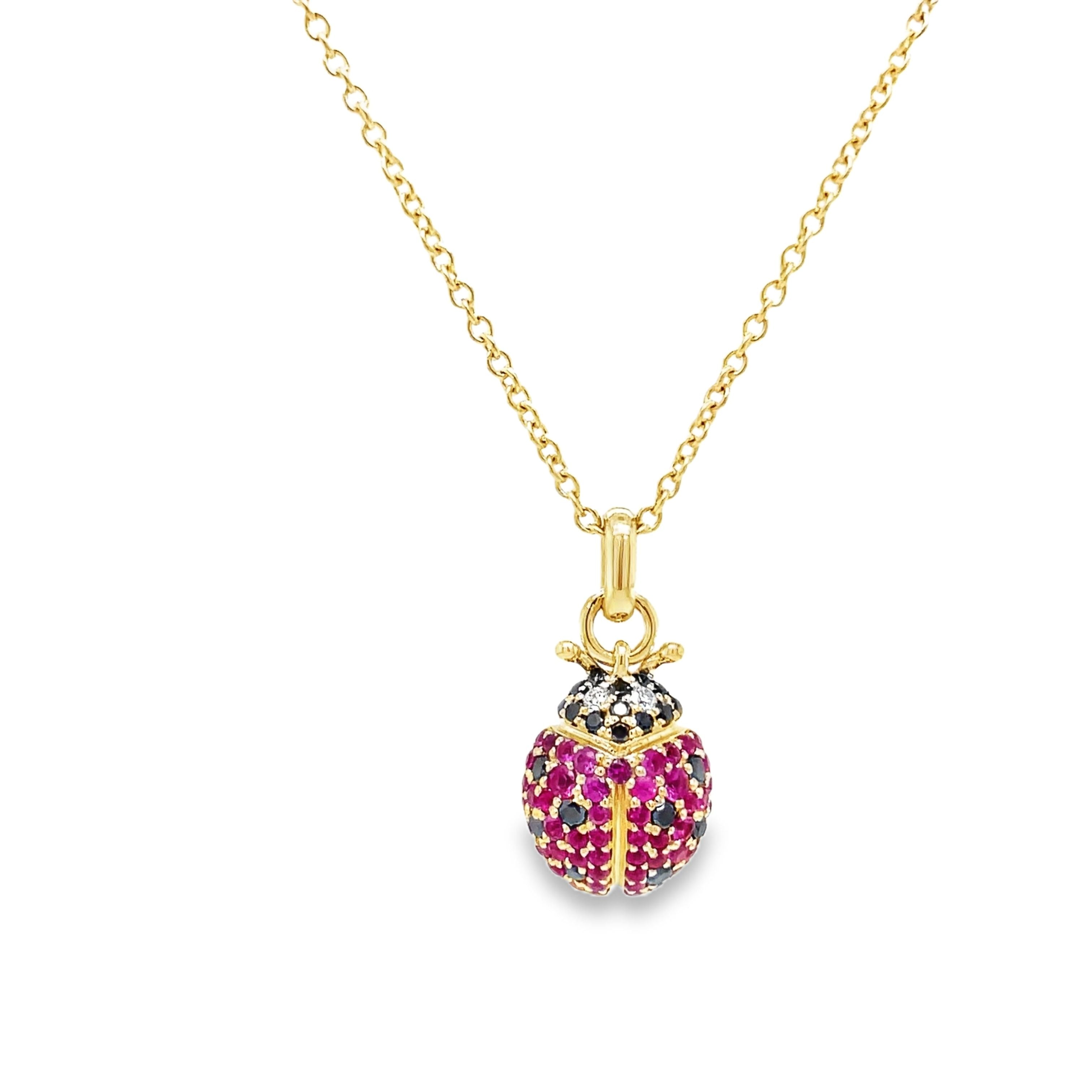 Indulge in luxury with our 14k Diamond Lady Bug Necklace. Crafted with 14k yellow gold, this exquisite piece features a 18.00 mm stunning lady bug design adorned with round black and pink sapphires totaling 0.49 carats. With an adjustable 18" chain and secure lobster clasp, this necklace adds a touch of sophistication to any outfit.