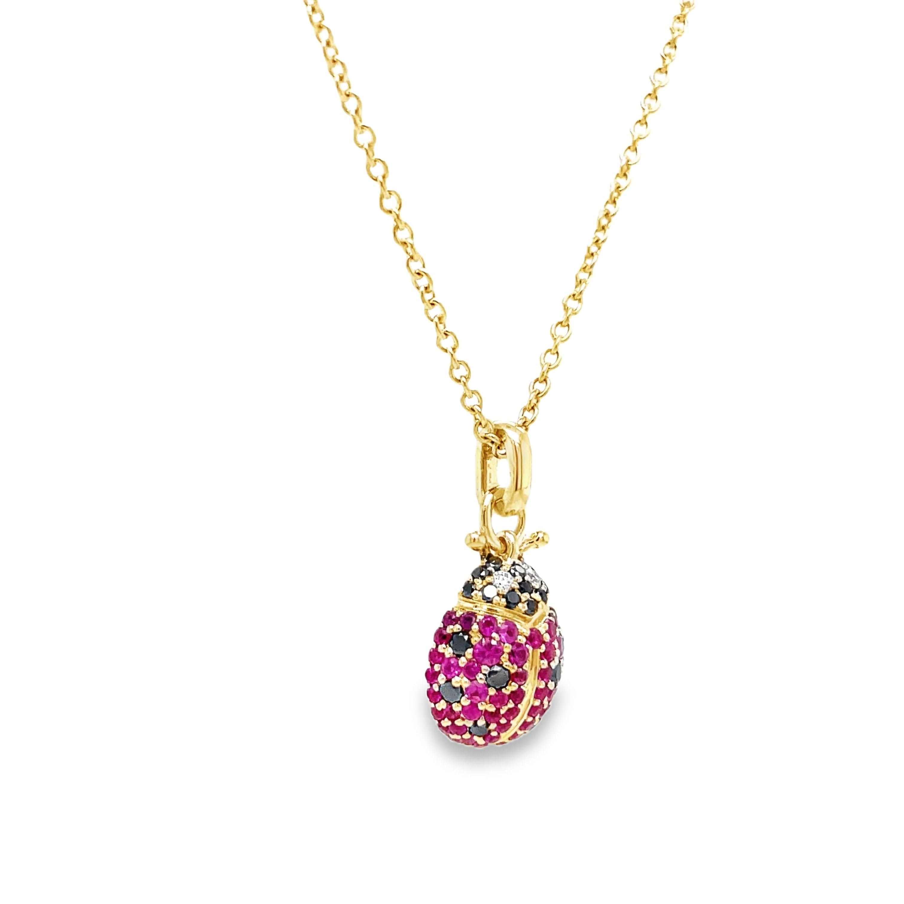 Indulge in luxury with our 14k Diamond Lady Bug Necklace. Crafted with 14k yellow gold, this exquisite piece features a 18.00 mm stunning lady bug design adorned with round black and pink sapphires totaling 0.49 carats. With an adjustable 18" chain and secure lobster clasp, this necklace adds a touch of sophistication to any outfit.