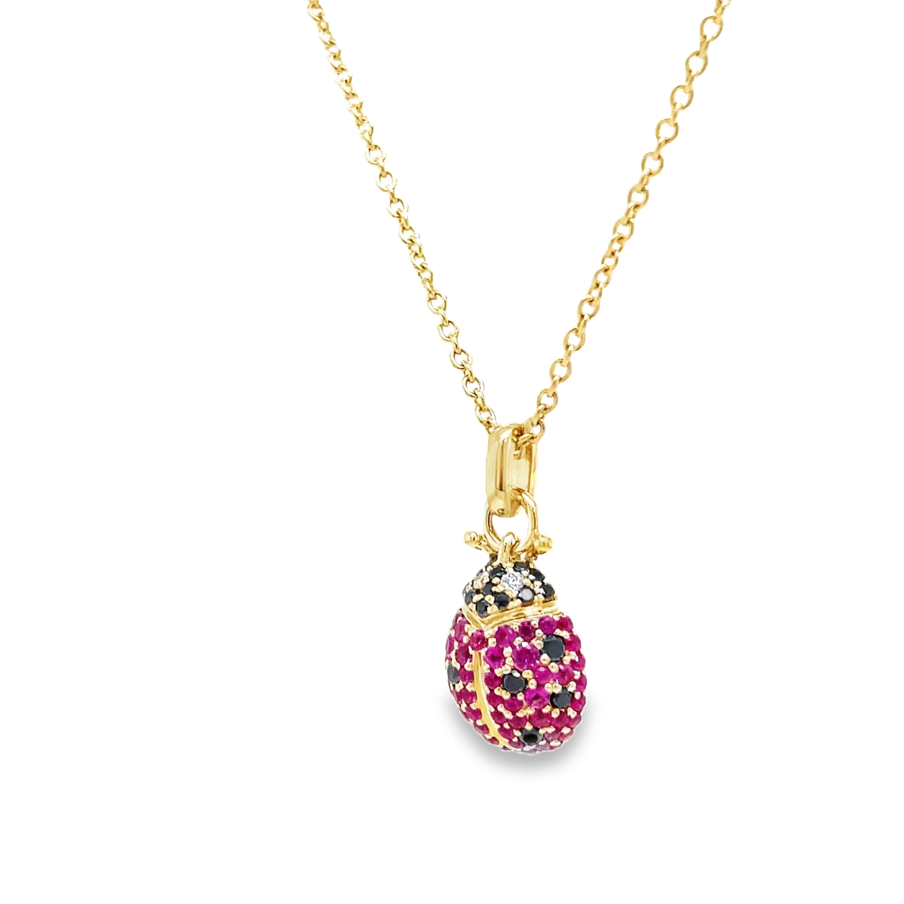 Indulge in luxury with our 14k Diamond Lady Bug Necklace. Crafted with 14k yellow gold, this exquisite piece features a 18.00 mm stunning lady bug design adorned with round black and pink sapphires totaling 0.49 carats. With an adjustable 18" chain and secure lobster clasp, this necklace adds a touch of sophistication to any outfit.