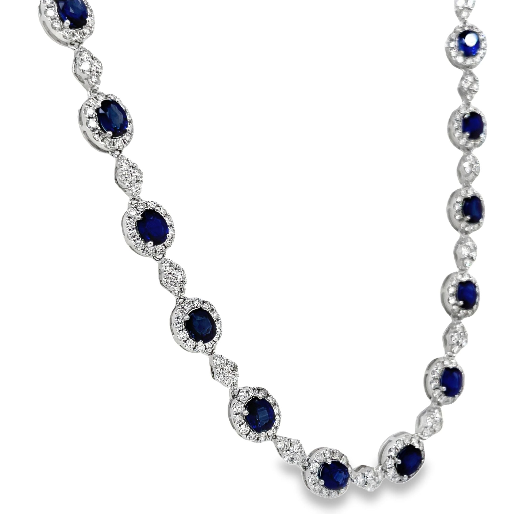 Indulge in luxury with our Blue Sapphire and Diamond Necklace. The 28 oval shape sapphires, totaling 14.67 carats, are complemented by 7.70 carats of round diamonds, set in 18k white gold. The hidden clasp ensures a seamless and elegant look, perfect for any occasion. Measuring 18", this necklace is a must-have for any sophisticated and exclusive wardrobe.