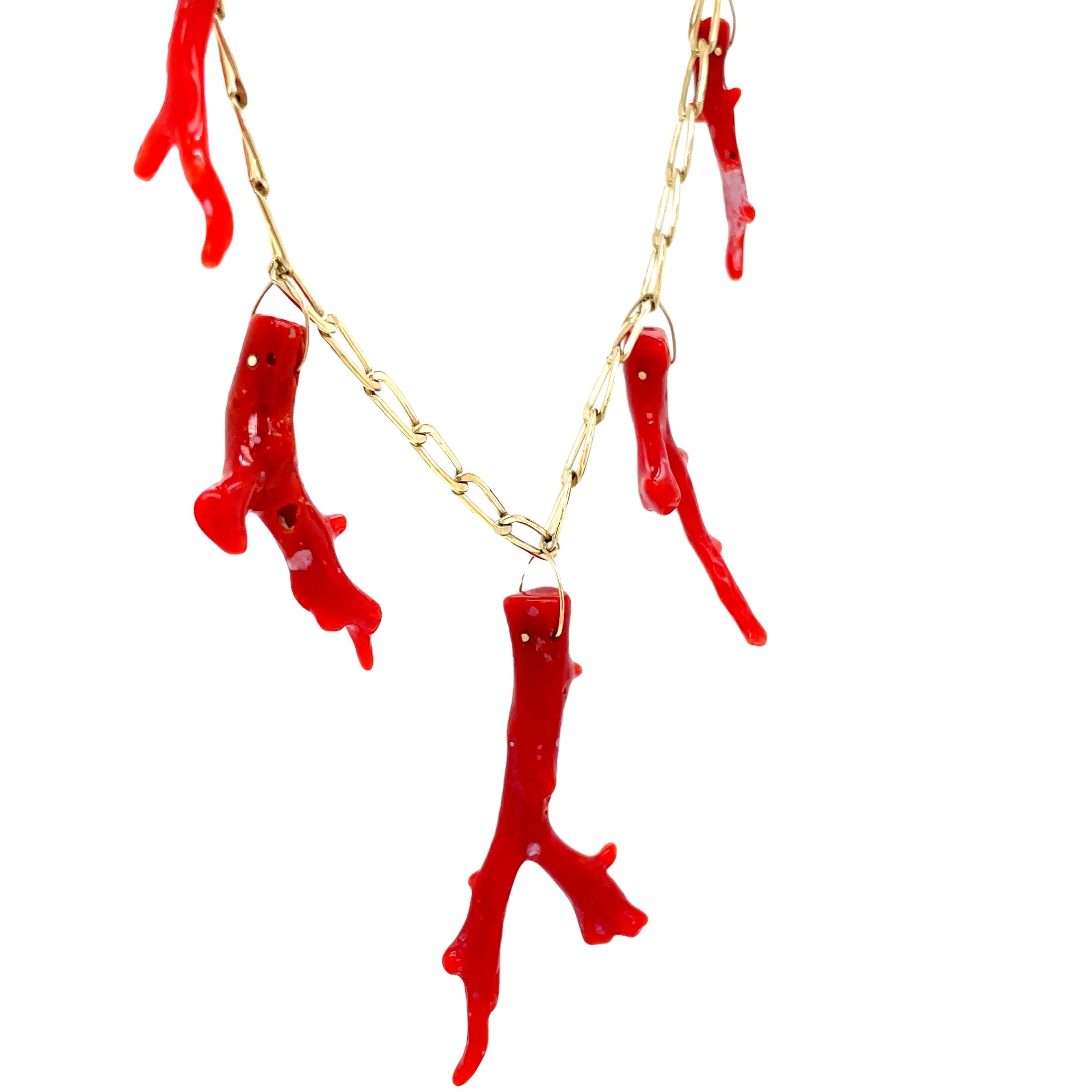 Elevate your jewelry collection with our Five Red Coral Branch Gold Cap Pendant. Crafted with 14k yellow gold and five vibrant red coral branches, this luxurious pendant exudes sophistication and exclusivity. The elegant paperclip chain link and secure lobster catch add a touch of modernity to this timeless piece. Make a statement with this exquisite pendant.