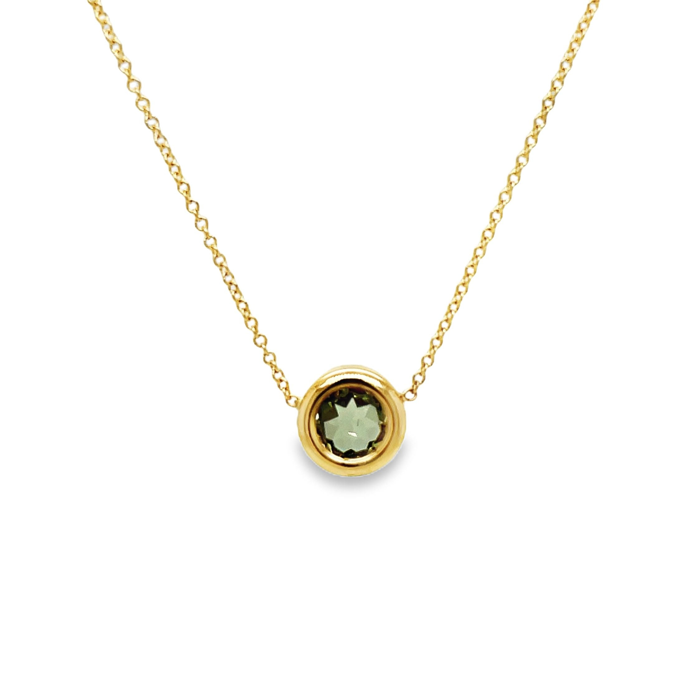 Indulge in the exquisite luxury of our Praziolite Gold Bezel Pendant Necklace. Adorned with a round praziolite gemstone and crafted from 14k yellow gold, this necklace exudes elegance. The delicate 1.1 mm gold chain adds a touch of sophistication. Elevate any outfit with this 18" long necklace.