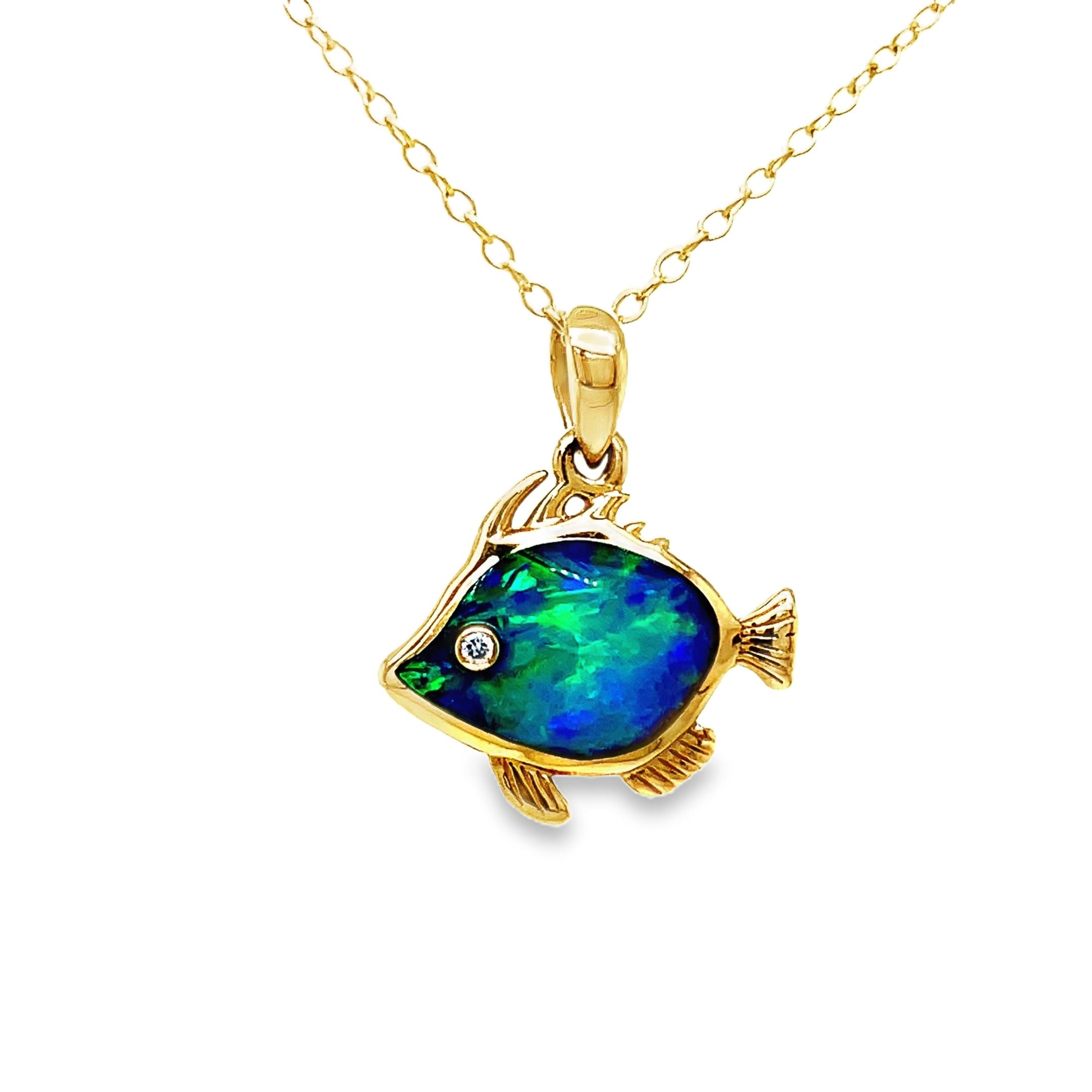 This exquisite 14k Diamond Opal Fish Pendant Necklace is a true work of art. Crafted with lustrous, 14k yellow gold, the play of color opal shimmers with an ethereal glow. The delicate fish pendant, adorned with a sparkling round diamond, adds a touch of whimsy to this luxurious piece. Elevate your wardrobe and make a statement with this one-of-a-kind necklace.