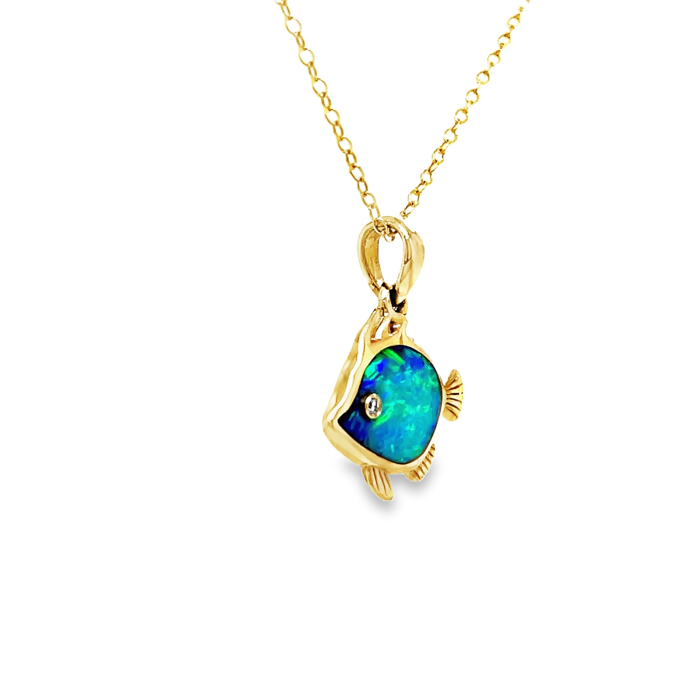 This exquisite 14k Diamond Opal Fish Pendant Necklace is a true work of art. Crafted with lustrous, 14k yellow gold, the play of color opal shimmers with an ethereal glow. The delicate fish pendant, adorned with a sparkling round diamond, adds a touch of whimsy to this luxurious piece. Elevate your wardrobe and make a statement with this one-of-a-kind necklace.