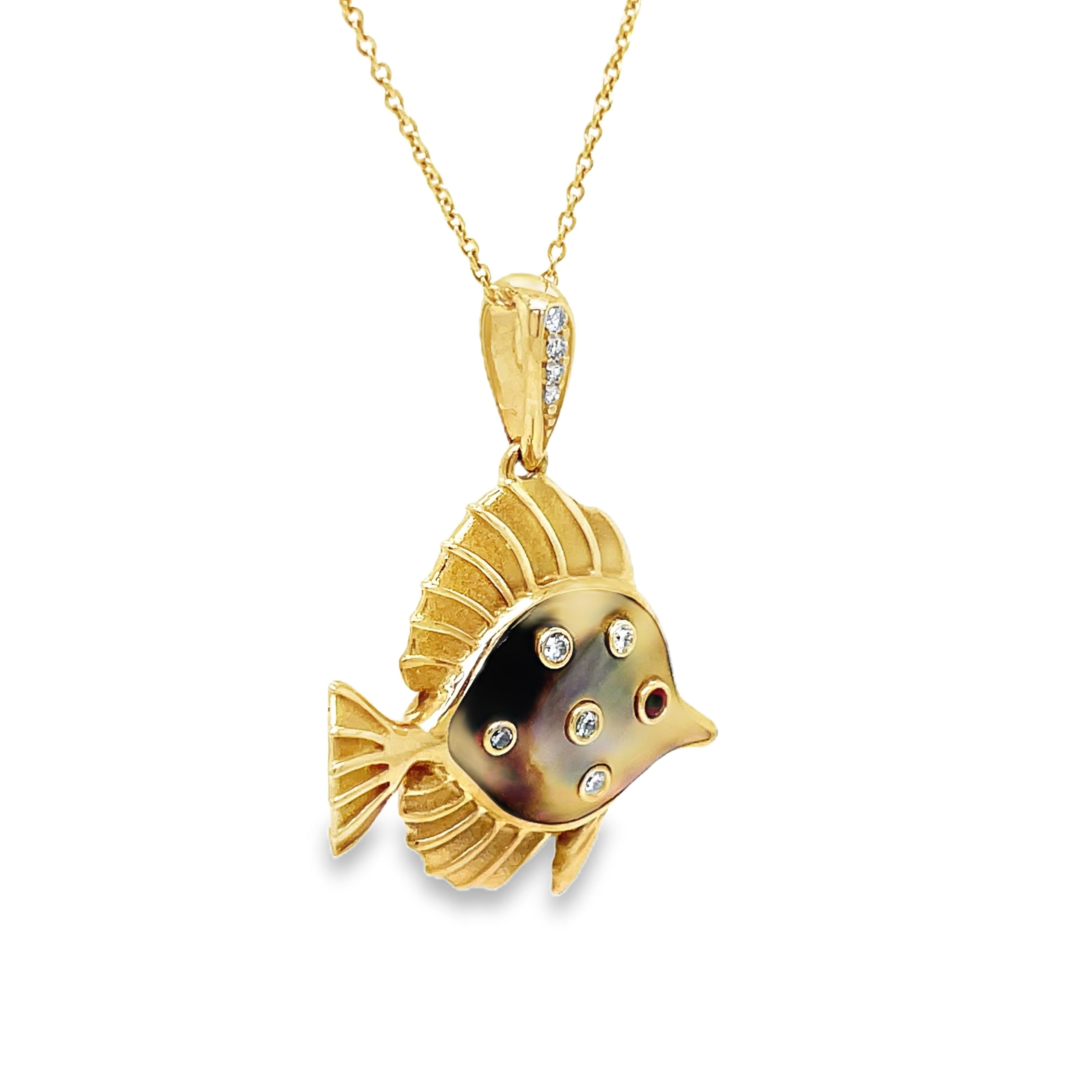 Indulge in sophistication with our 14k Diamond and MOP Fish Pendant Necklace. Crafted from luxurious 14k yellow gold, this necklace features a beautiful MOP fish pendant adorned with round diamonds and a stunning round ruby. Elevate any look with this elegant and exclusive piece.