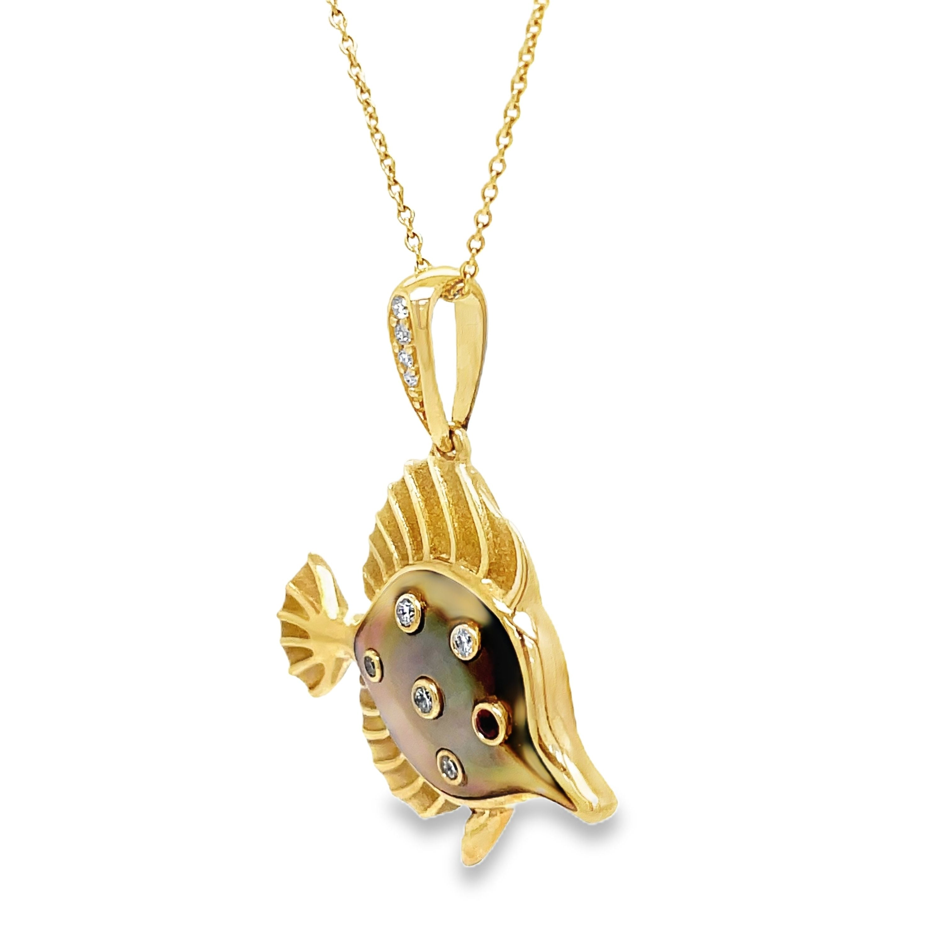 Indulge in sophistication with our 14k Diamond and MOP Fish Pendant Necklace. Crafted from luxurious 14k yellow gold, this necklace features a beautiful MOP fish pendant adorned with round diamonds and a stunning round ruby. Elevate any look with this elegant and exclusive piece.