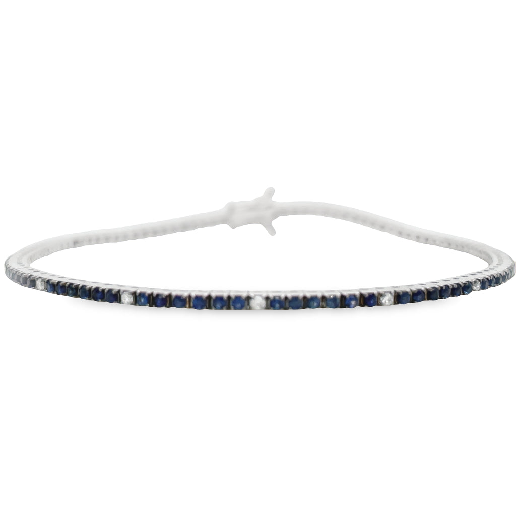This blue sapphire & Diamond Line Bracelet is an elegant accessory for any occasion. Crafted in 18k white gold, this bracelet features stunning blue sapphires stones 1.18 cts and round diamonds 0.14 cts, creating a unique look. With its eye-catching design, this bracelet is the ideal way to add a touch of sophistication to your style.