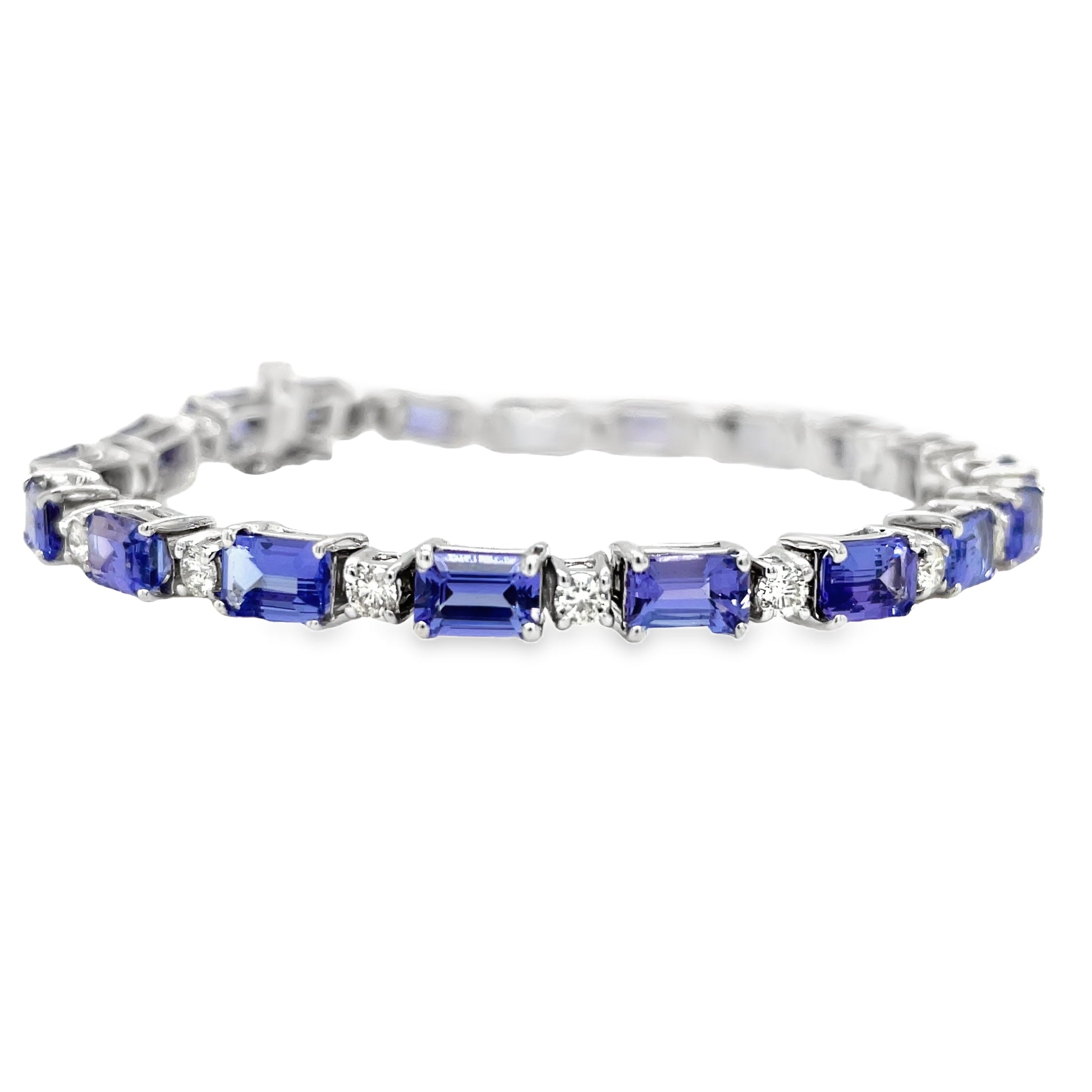 Indulge in luxury with our Fine Diamond &amp; Tanzanite Rectangular Shape Bracelet. Crafted with 14k white gold, this stunning piece features a radiant 11.35 cts rectangular tanzanite gem and sparkling round diamonds. Elevate any outfit with this exquisite bracelet that exudes sophistication and exclusivity.