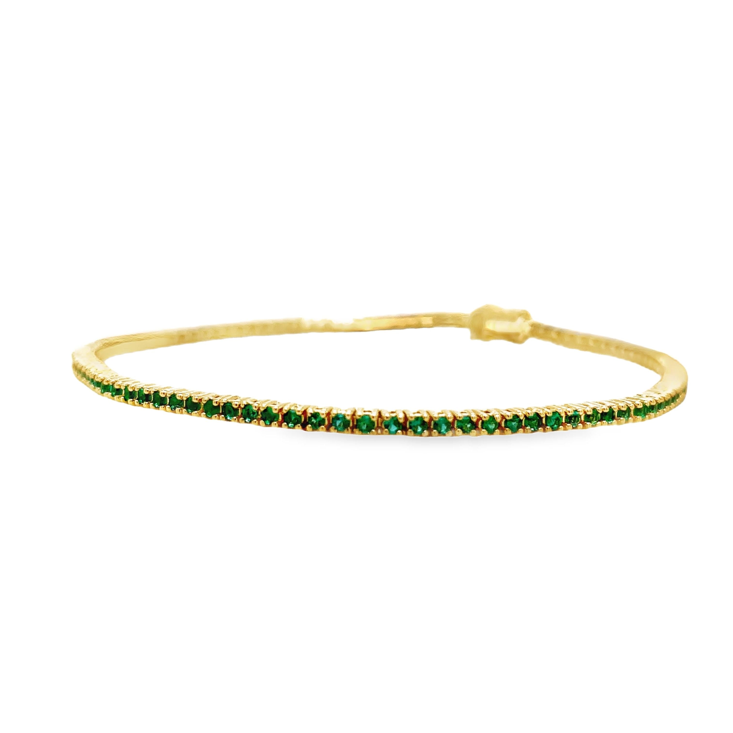 ndulge in luxury with our 18k Italian Made Emerald Line Tennis Yellow Gold Bracelet. Handcrafted in Italy, this exquisite piece features 1.00 cts of round emeralds with good color. The secure clasp ensures peace of mind, making it a must-have for your jewelry collection. Elevate your style with this exclusive line bracelet.