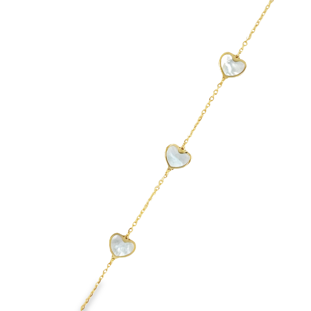 This elegant 14k yellow gold bracelet features five intricately detailed mother of pearl hearts and a secure lobster clasp. The clovers measure 7.0 mm in size and the bracelet itself exudes sophistication and style.   