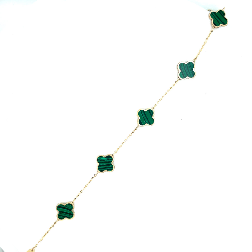 This elegant 14k yellow gold bracelet features five intricately detailed malachite clovers and a secure lobster clasp. The clovers measure 9.0 mm in size and the bracelet itself exudes sophistication and style.   