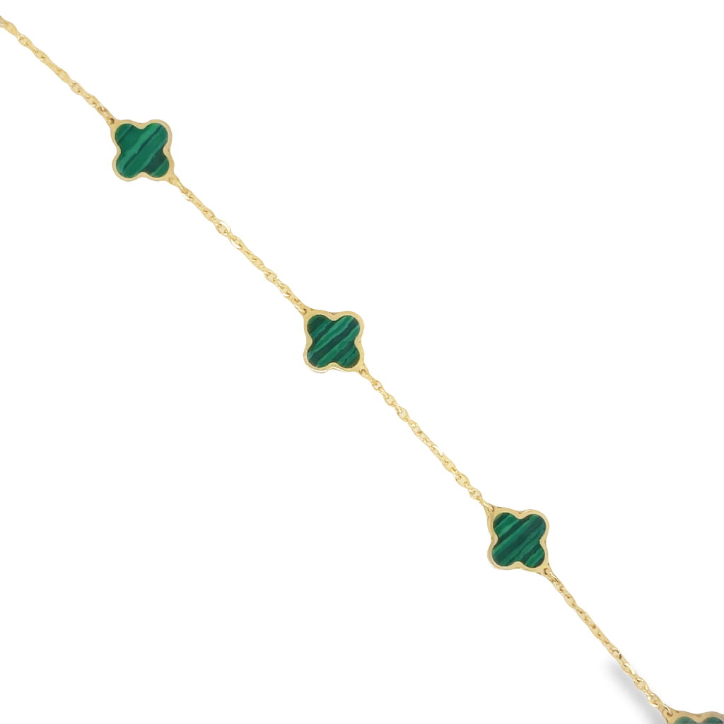 This elegant 14k yellow gold bracelet features five intricately detailed malachite clovers and a secure lobster clasp. The clovers measure 7.0 mm in size and the bracelet itself exudes sophistication and style.   