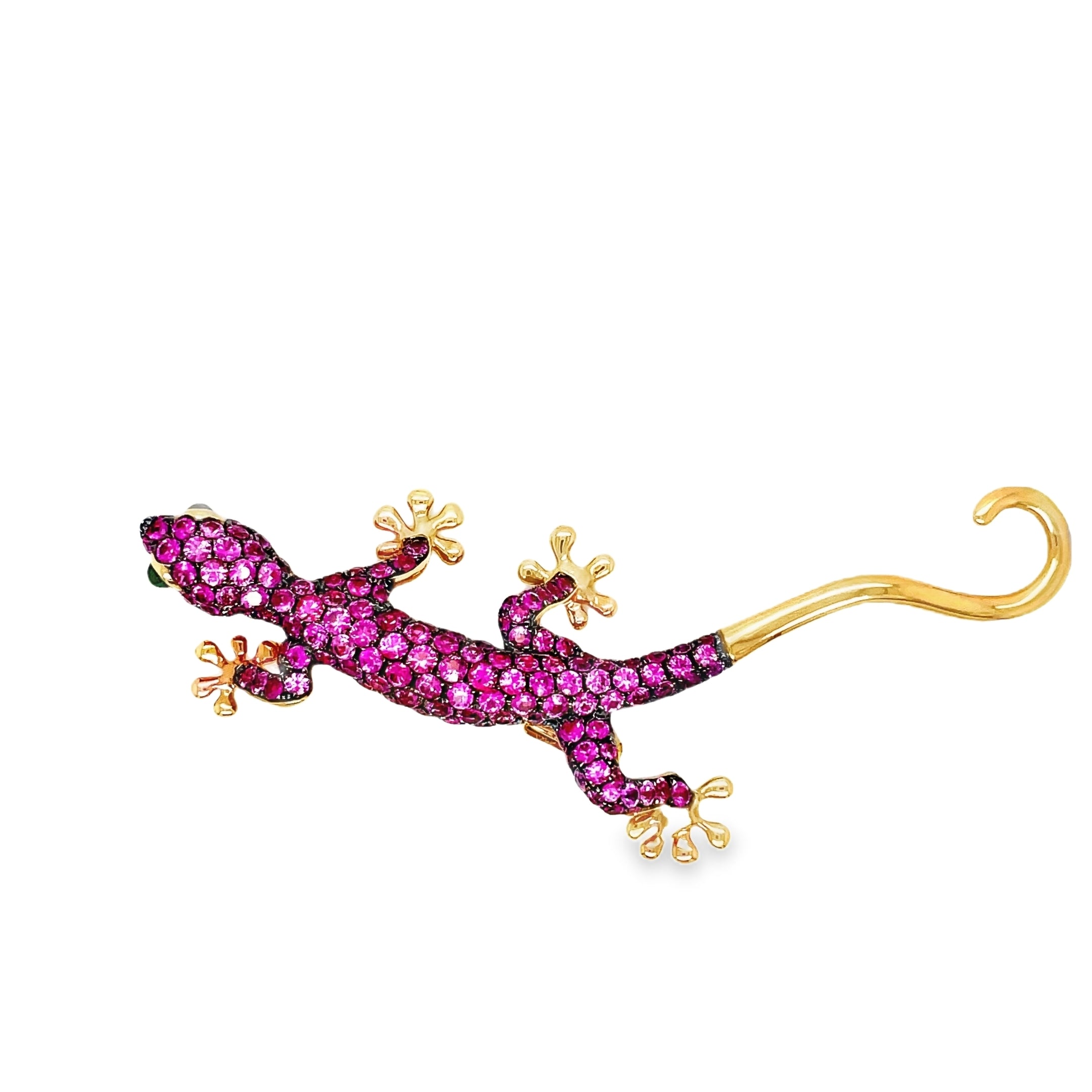 Indulge in timeless elegance with our Pink Sapphire and Emerald Lizard Brooch. Crafted from 18k rose gold, this luxurious piece features two mesmerizing emerald eyes and delicate pink sapphires. Versatile as both a pendant and brooch, this lizard adds a touch of sophistication to any outfit. Make a statement with this unique and stunning accessory.