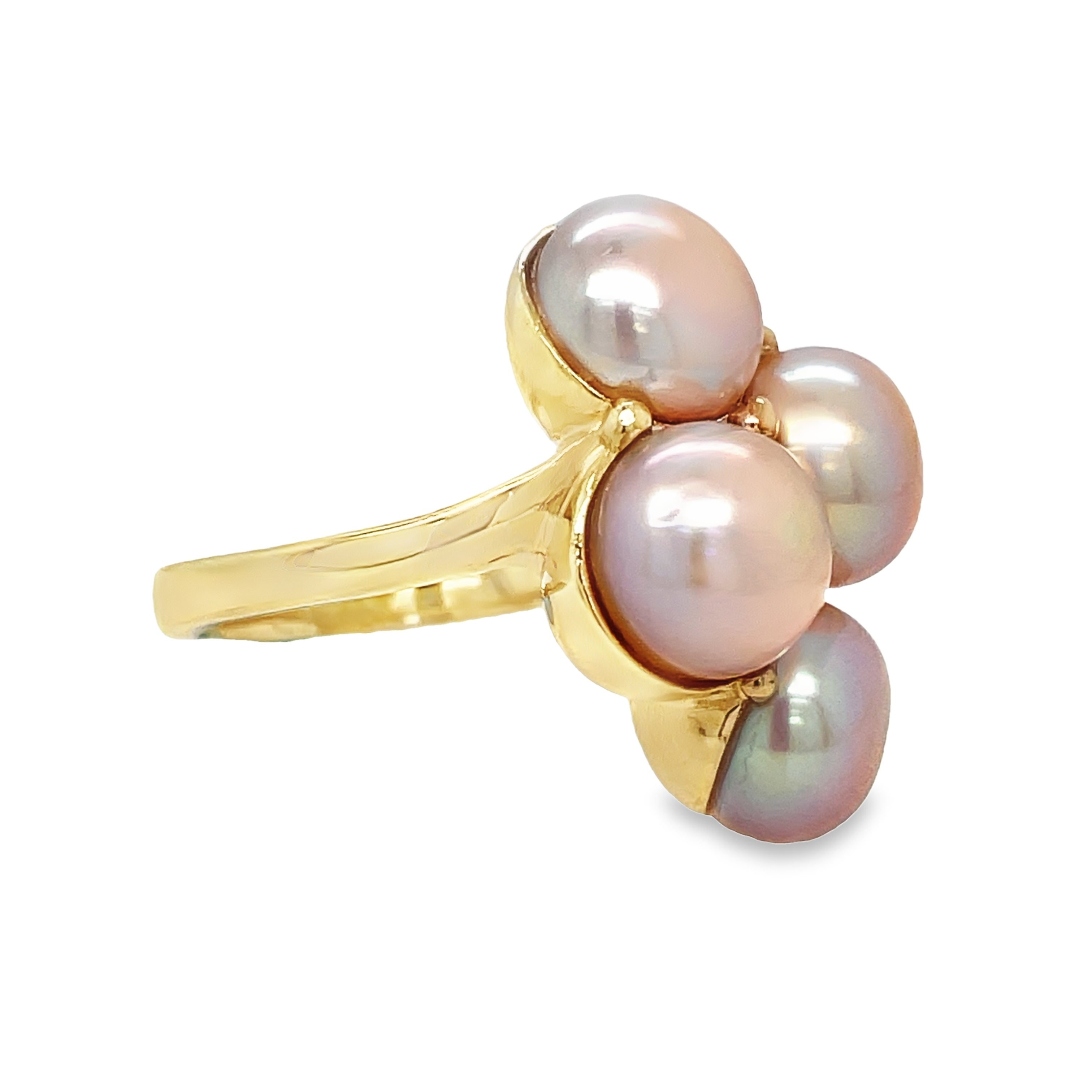 This exquisite Four Pearl Gold Ring showcases a stunning combination of fresh water pearls and 14k yellow gold. With a 6.5 size and solid ring design, it is a must-have for any jewelry collection. Part of our exclusive estate collection, this ring offers both elegance and quality.