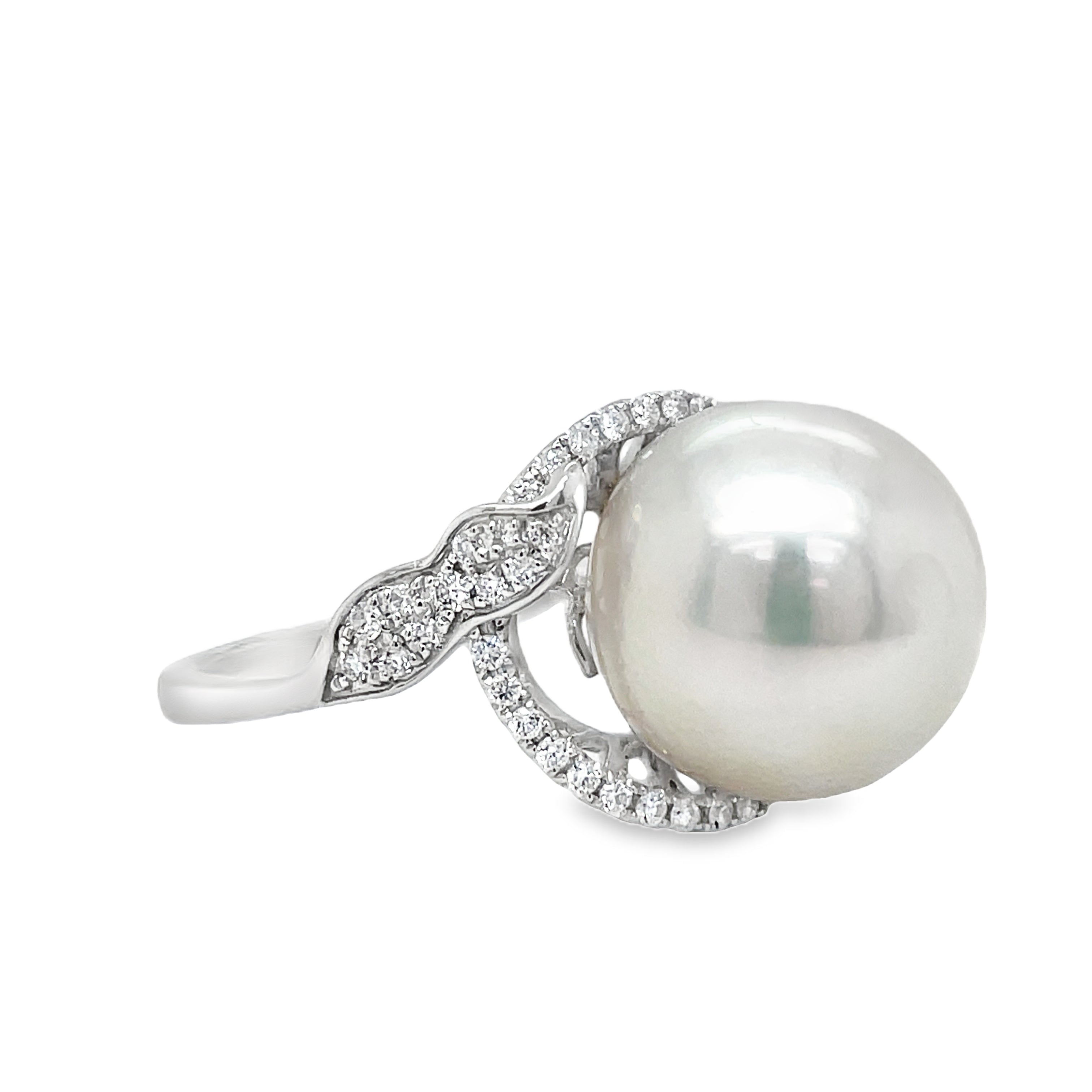 This Large South Sea Pearl Diamond Ring features a stunning 12.50 mm south sea pearl with great luster set in 14k white gold. The round diamonds, totaling 0.28 carats, add a touch of elegance and luxury. Elevate any outfit with this exquisite piece of jewelry.