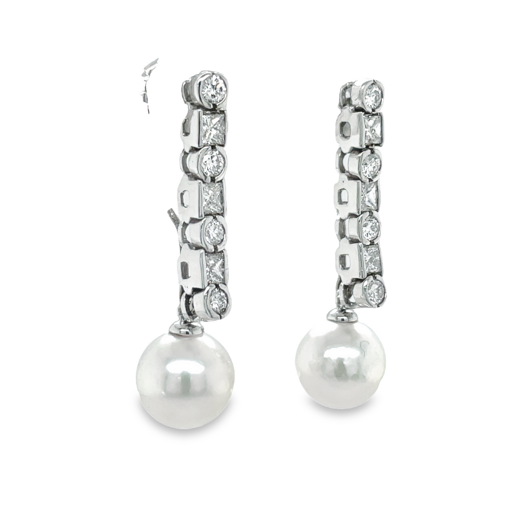 Gorgeous Diamond Drop Earrings feature 14 diamonds 1.15 cts set in 14k white gold. These earrings are 1 1/4" long and include detachable 10.00 mm Akoya Pearls with good luster. A timeless and classic look for any occasion.