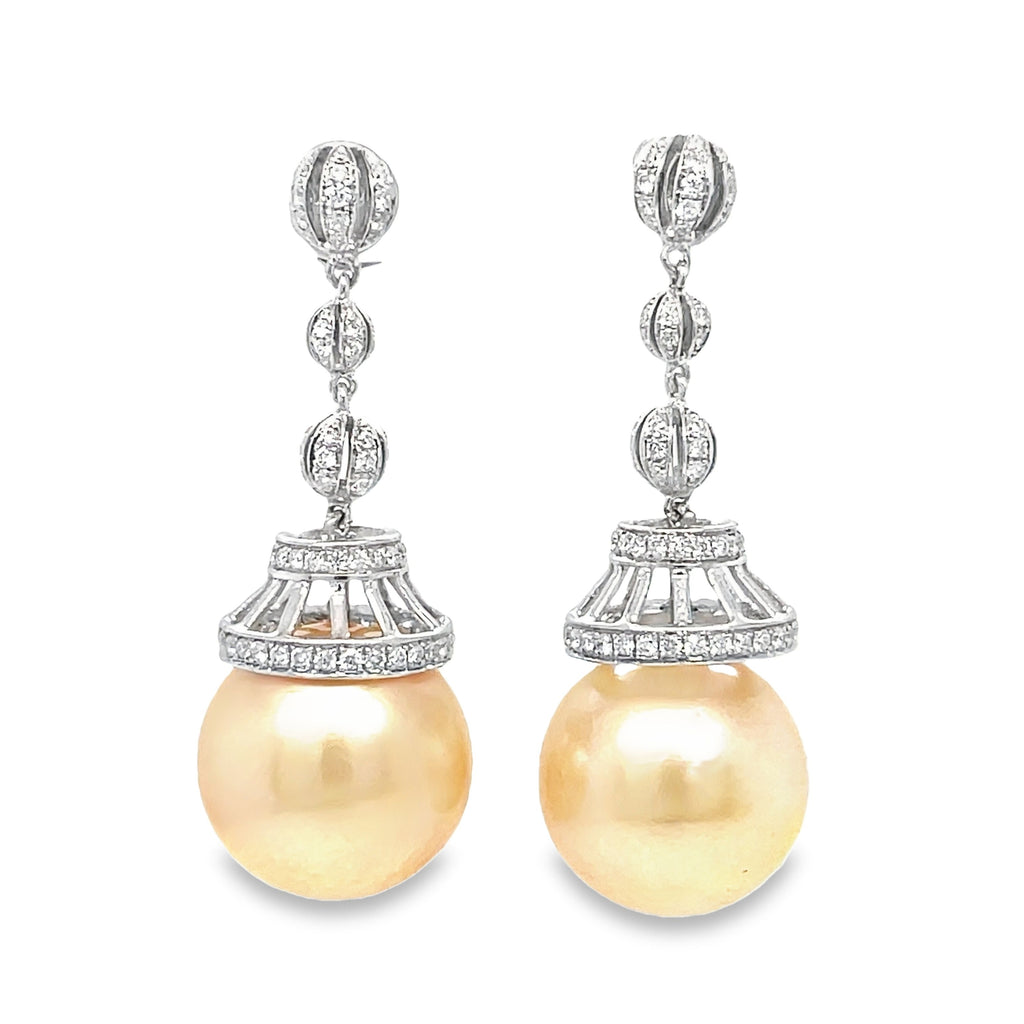 Add elegance and sophistication to your outfit with our South Seas and Diamond Drop Earrings. Featuring 14.00 mm South Seas pearls, 18k white gold, and 0.98 cts round diamonds, these earrings are the perfect statement piece to make you stand out. Elevate your style with these luxurious and timeless earrings!"