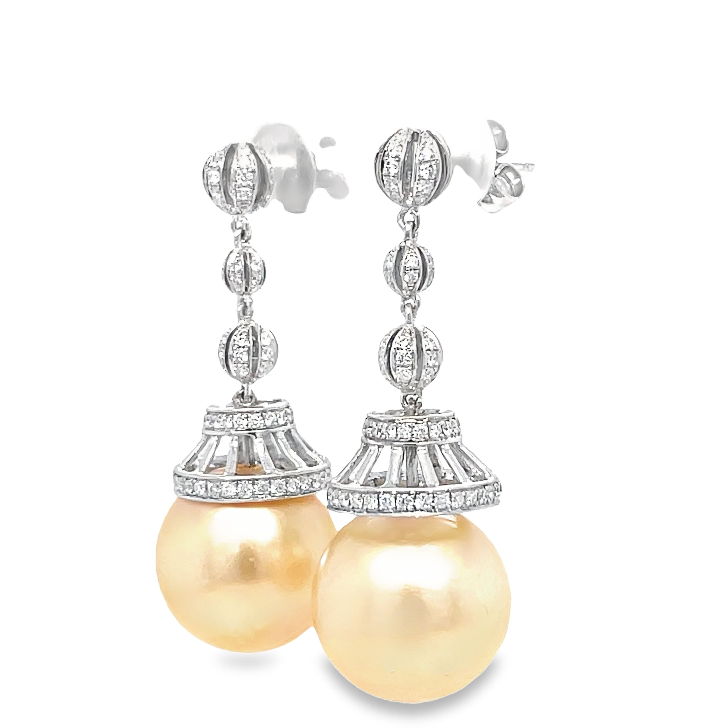Add elegance and sophistication to your outfit with our South Seas and Diamond Drop Earrings. Featuring 14.00 mm South Seas pearls, 18k white gold, and 0.98 cts round diamonds, these earrings are the perfect statement piece to make you stand out. Elevate your style with these luxurious and timeless earrings!"